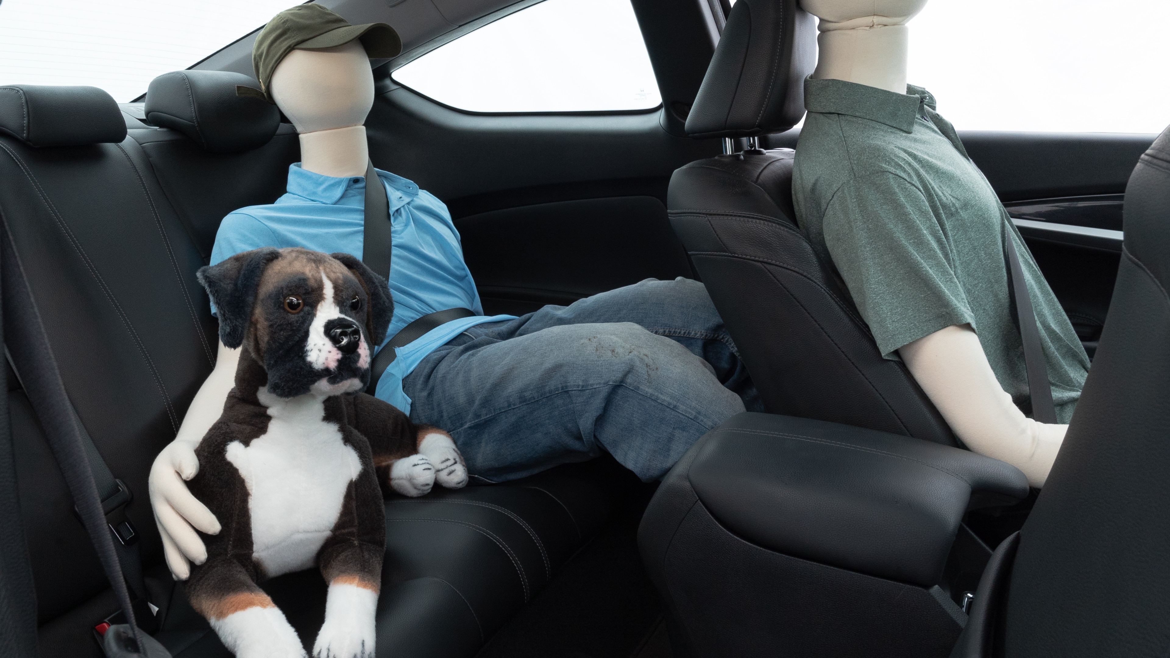 A series of second-row backseat photos is shown including one seating a baby seat and one seating a 6'1" mannequin.