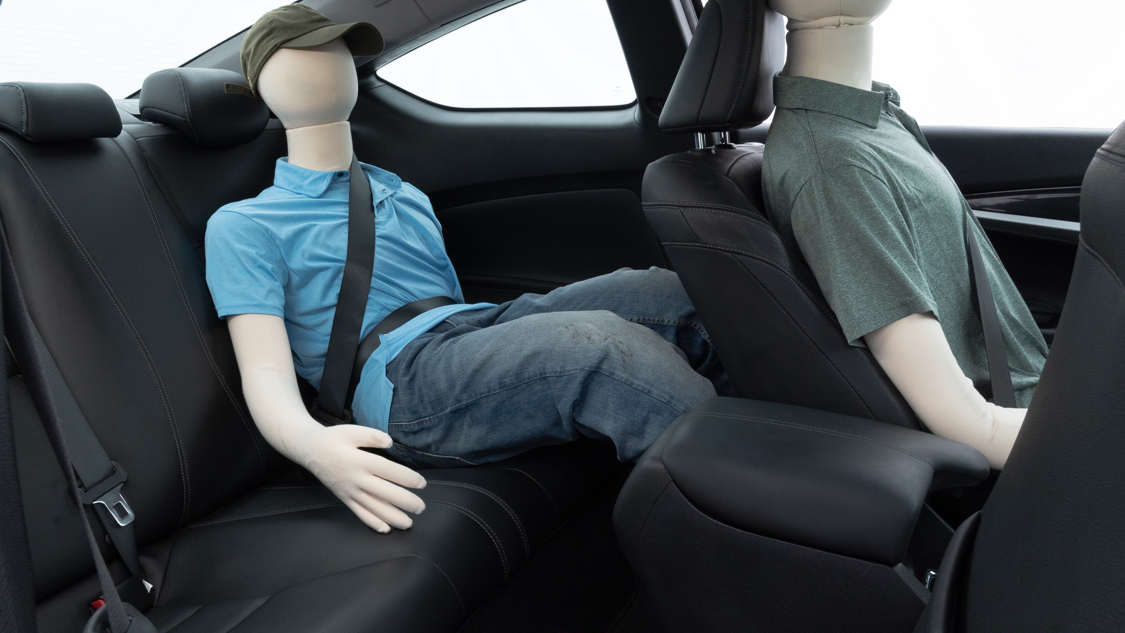 A series of second-row backseat photos is shown including one seating a baby seat and one seating a 6'1" mannequin.