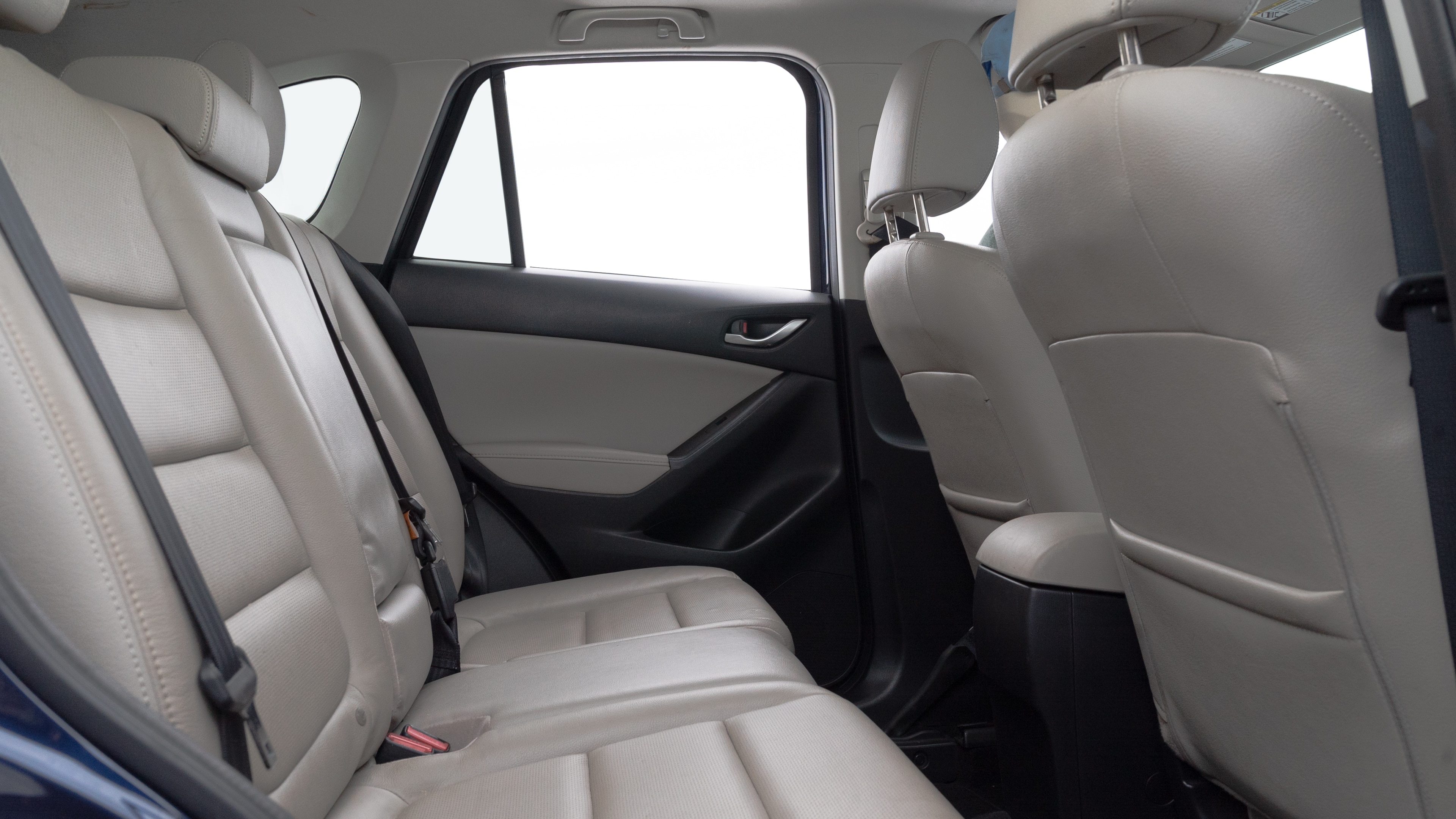 A series of second-row backseat photos is shown including one seating a baby seat and one seating a 6'1" mannequin.