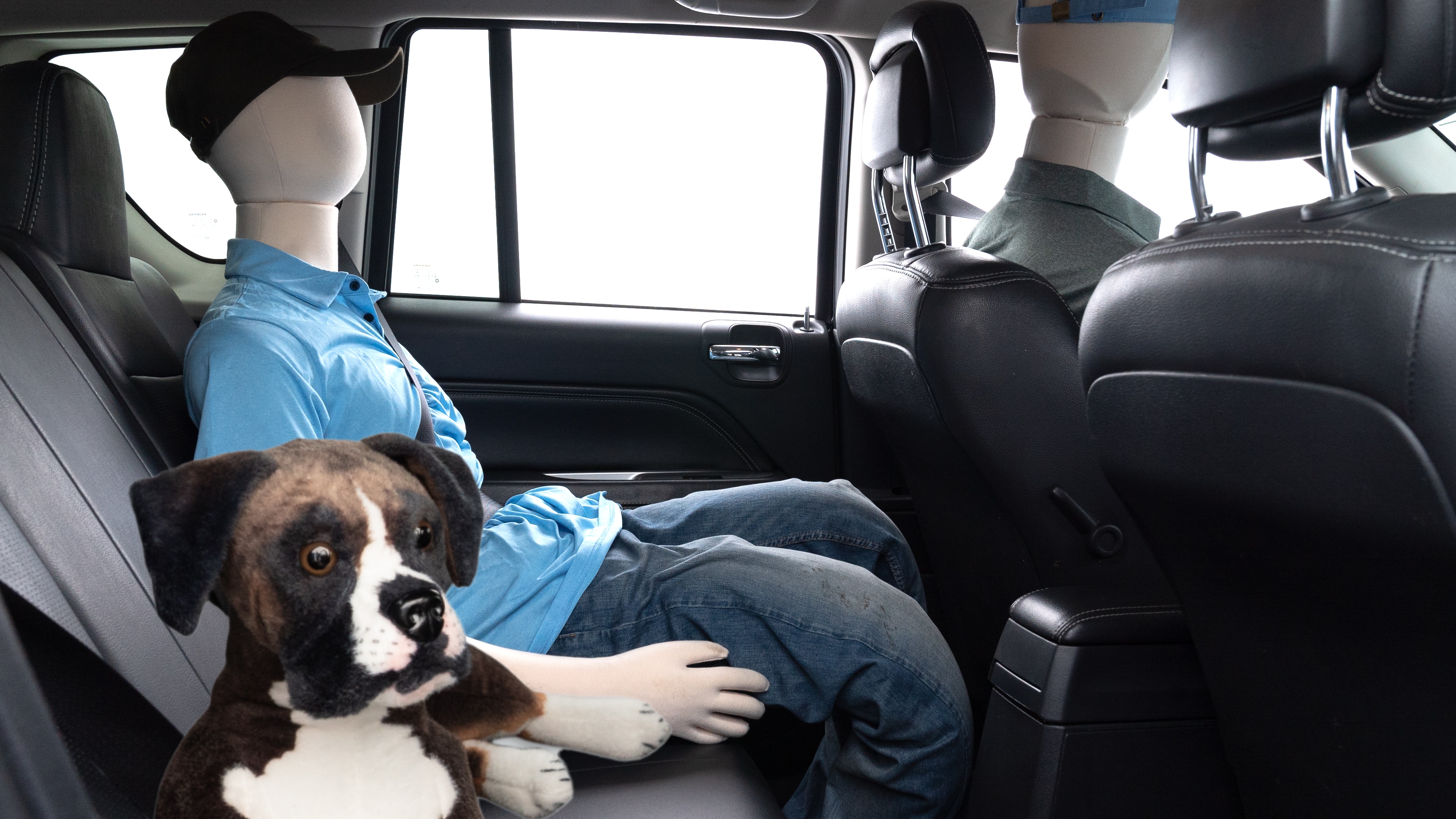A series of second-row backseat photos is shown including one seating a baby seat and one seating a 6'1" mannequin.