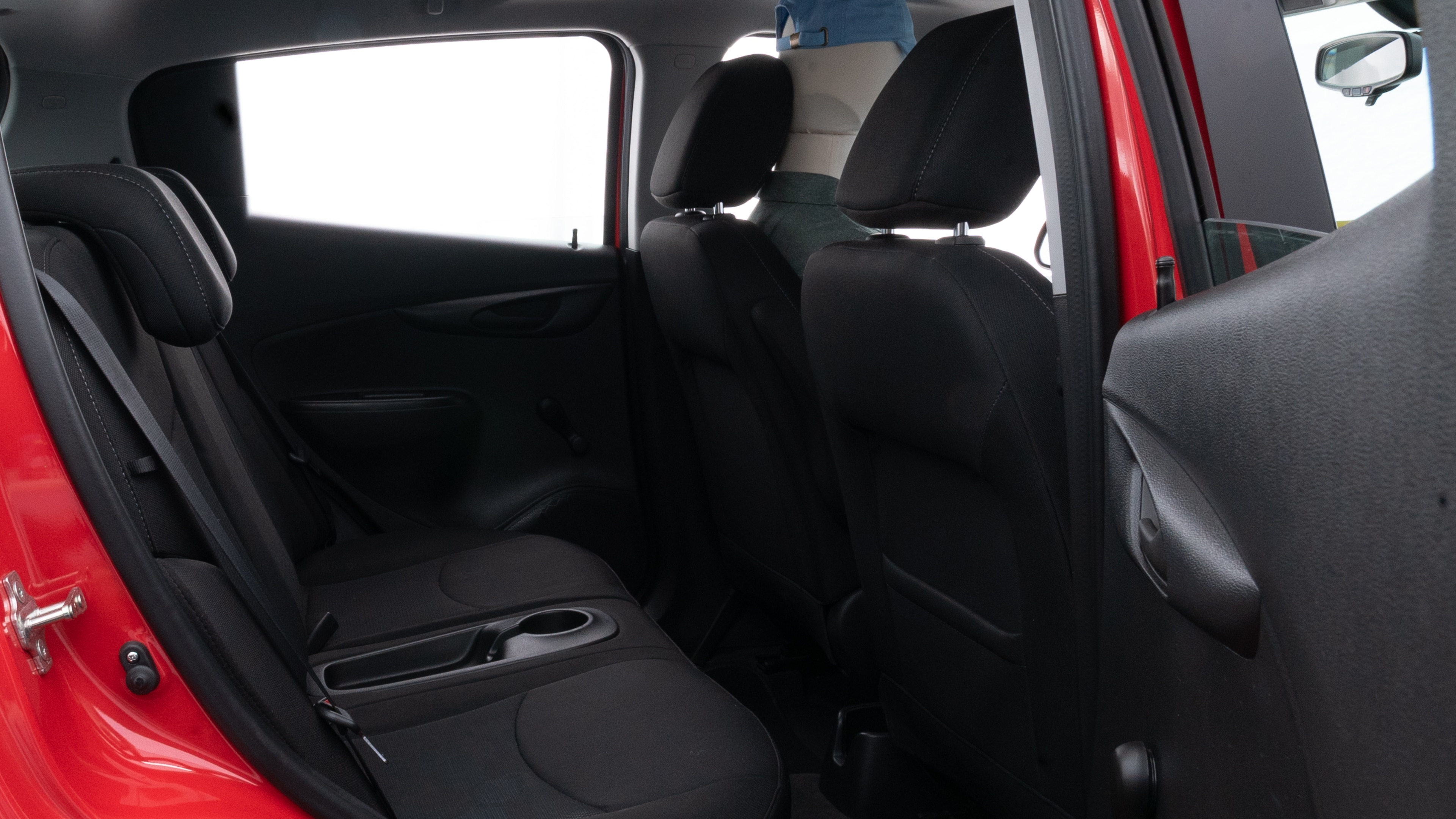 A series of second-row backseat photos is shown including one seating a baby seat and one seating a 6'1" mannequin.