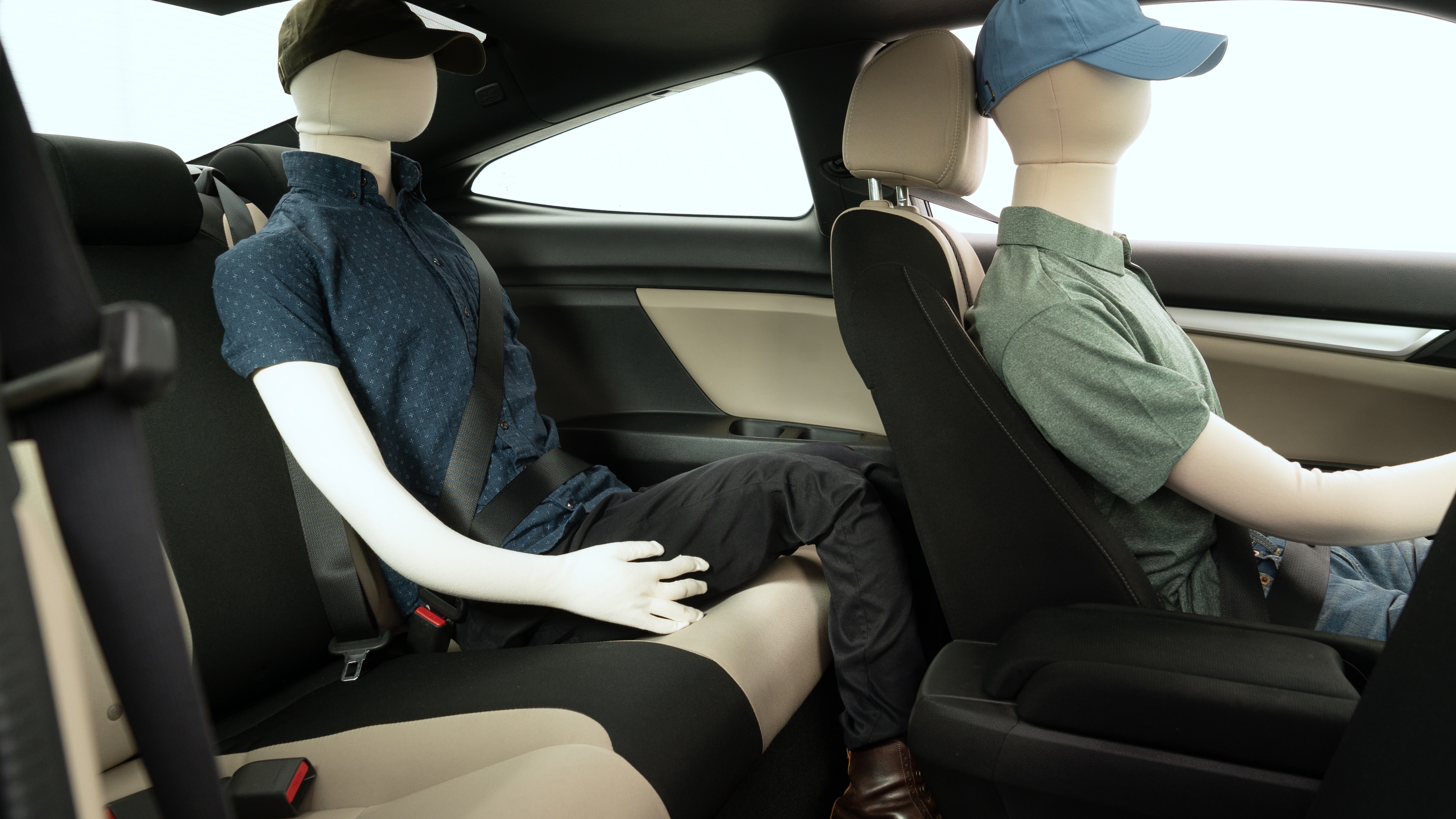 A series of second-row backseat photos is shown including one seating a baby seat and one seating a 6'1" mannequin.