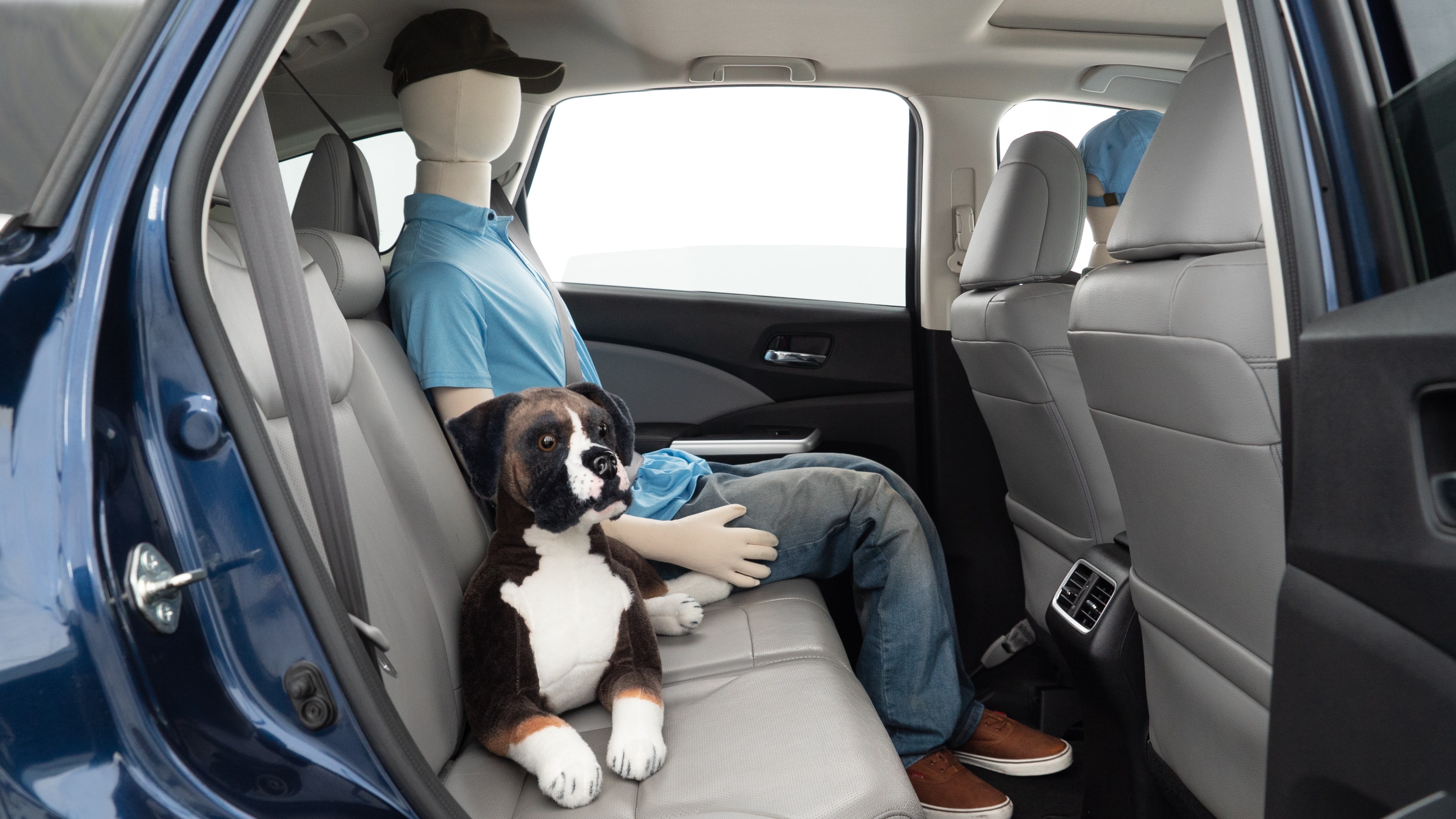 A series of second-row backseat photos is shown including one seating a baby seat and one seating a 6'1" mannequin.
