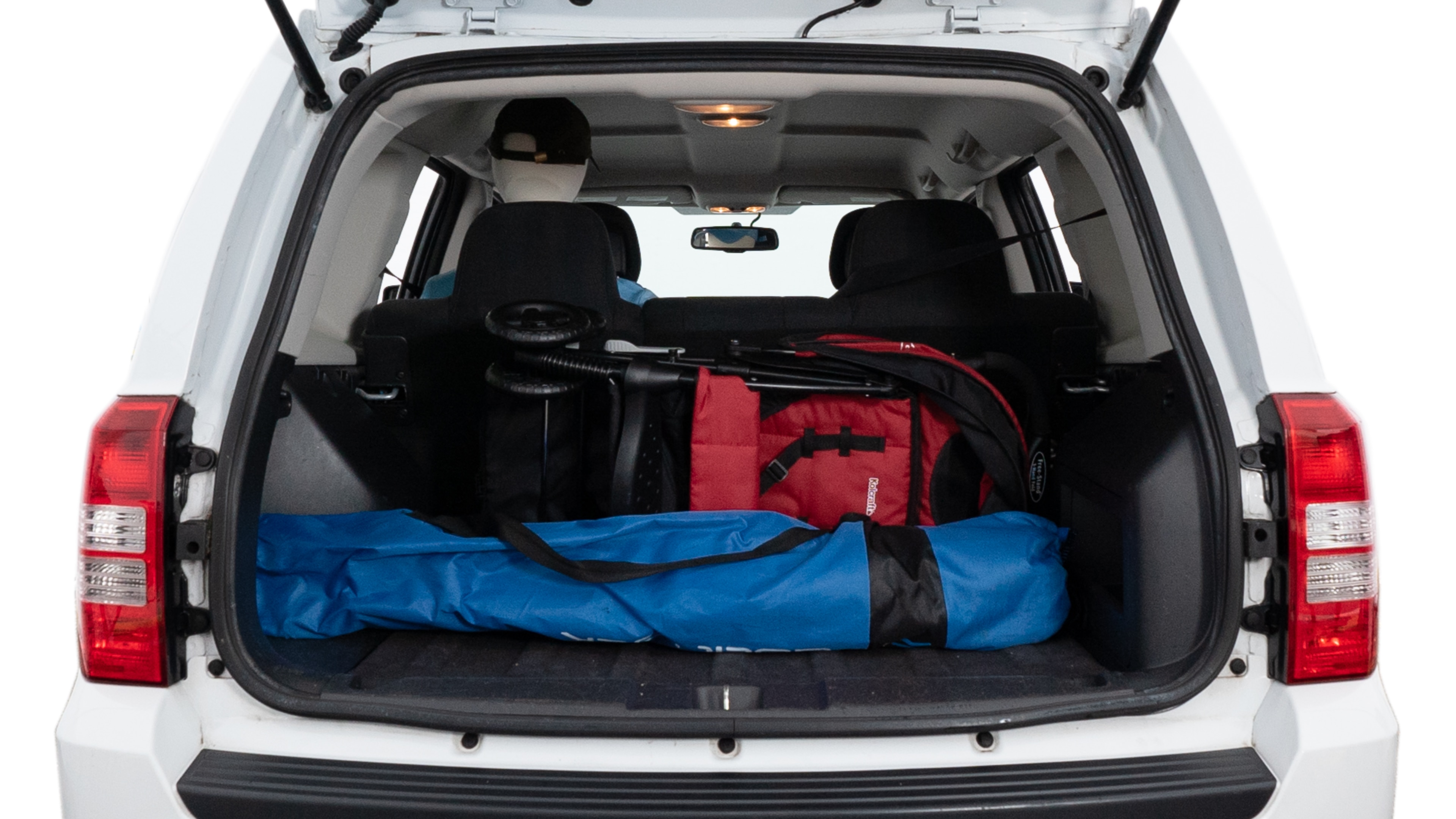 The trunk lid is open showing full view of the trunk. A baby stroller, three grocery carriers, two camping chairs in the carrying bag, and a set of golf clubs are placed inside.