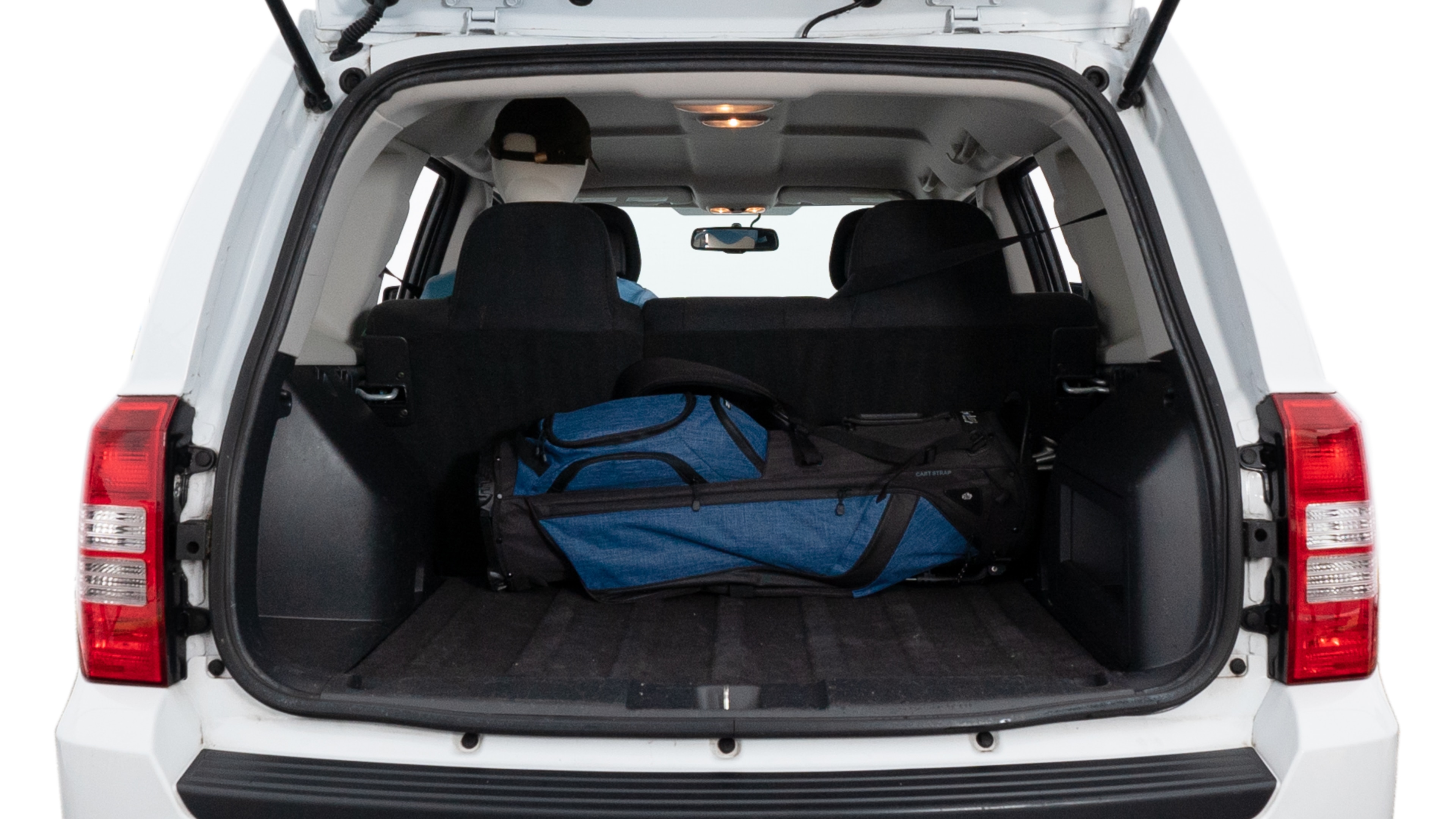 The trunk lid is open showing full view of the trunk. A baby stroller, three grocery carriers, two camping chairs in the carrying bag, and a set of golf clubs are placed inside.