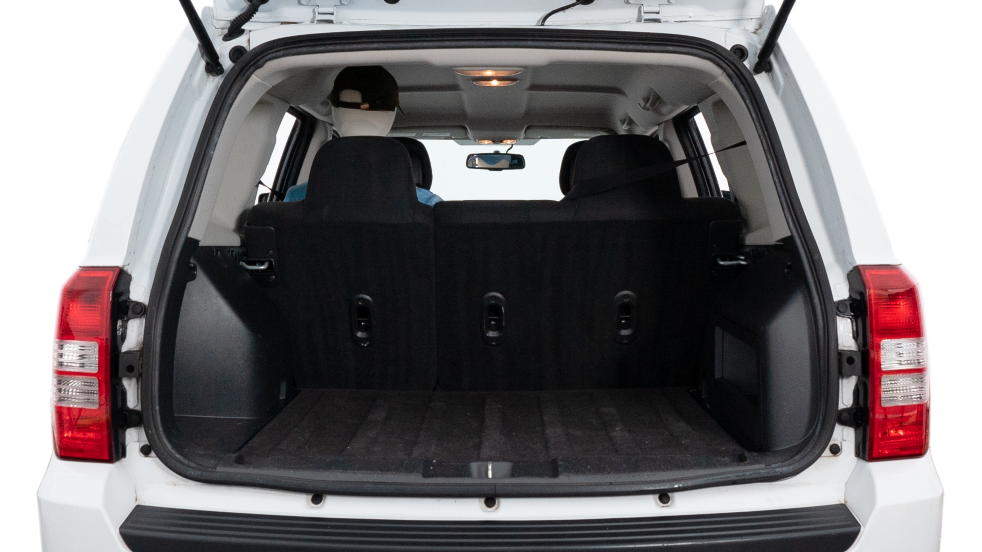 The trunk lid is open showing full view of the trunk. A baby stroller, three grocery carriers, two camping chairs in the carrying bag, and a set of golf clubs are placed inside.