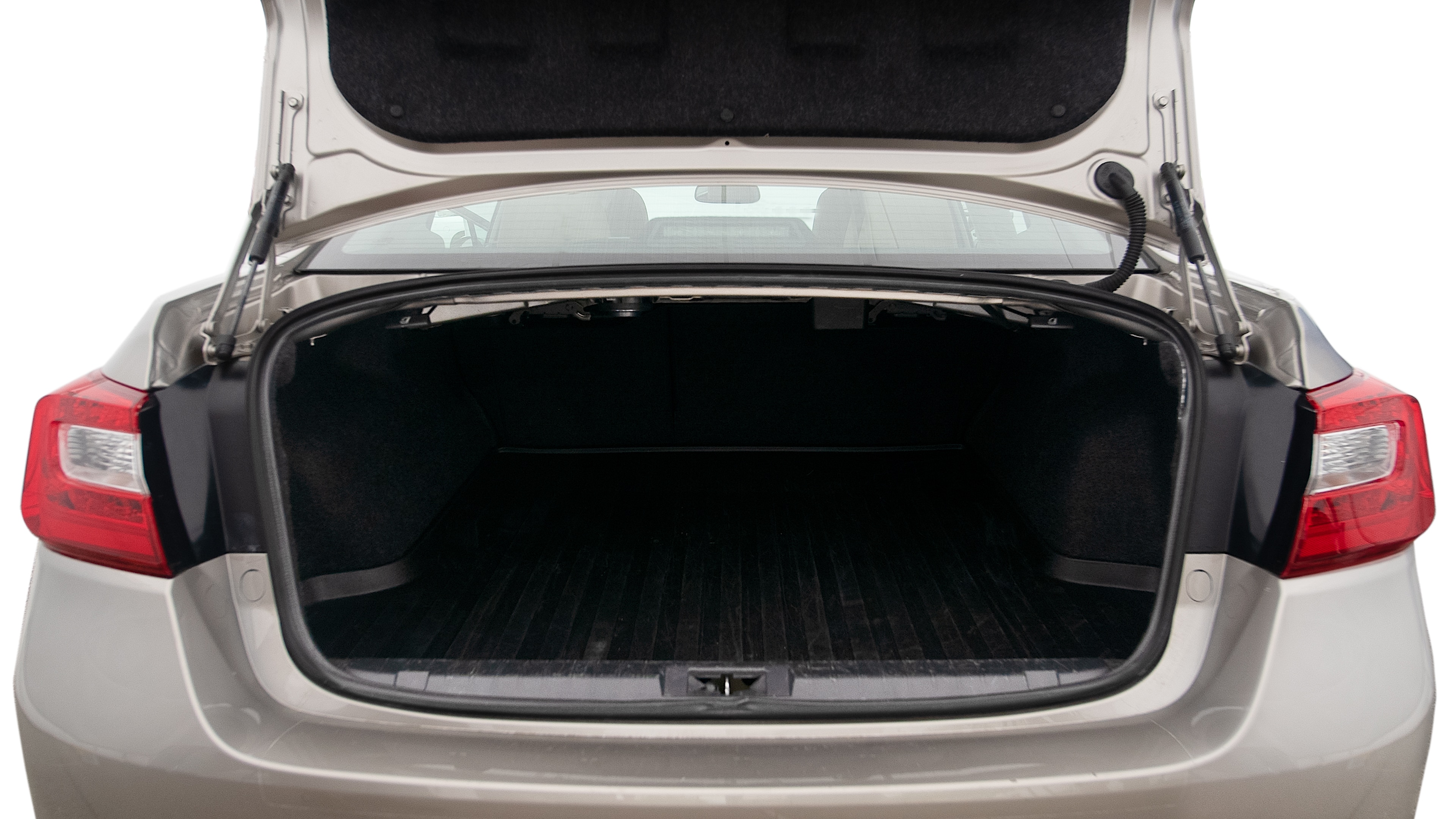 The trunk lid is open showing full view of the trunk. A baby stroller, three grocery carriers, two camping chairs in the carrying bag, and a set of golf clubs are placed inside.