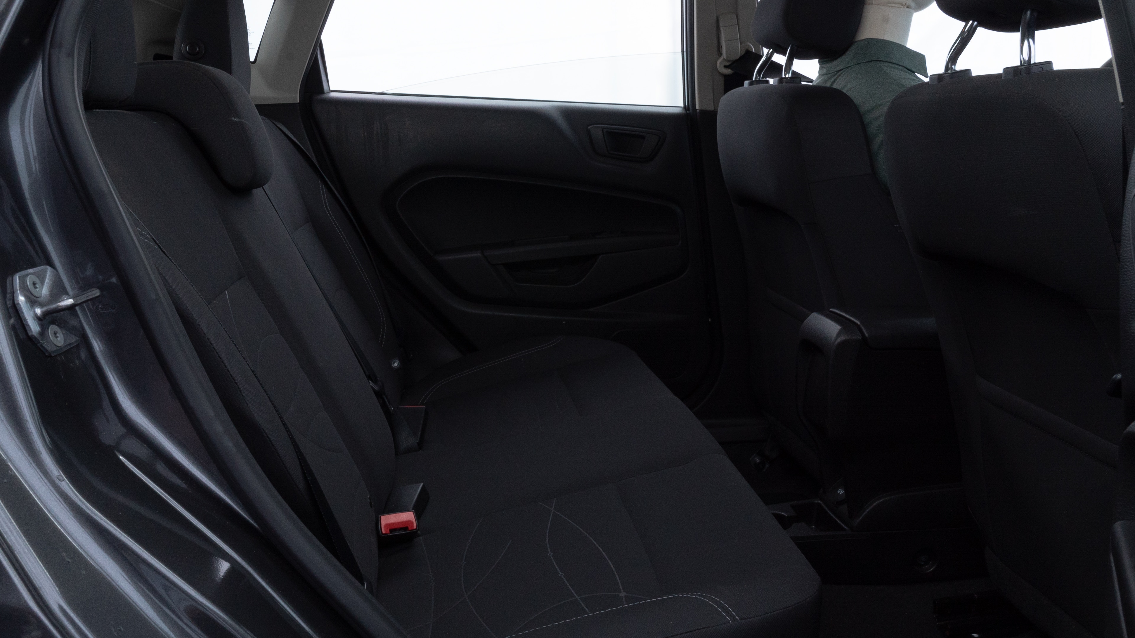 A series of second-row backseat photos is shown including one seating a baby seat and one seating a 6'1" mannequin.