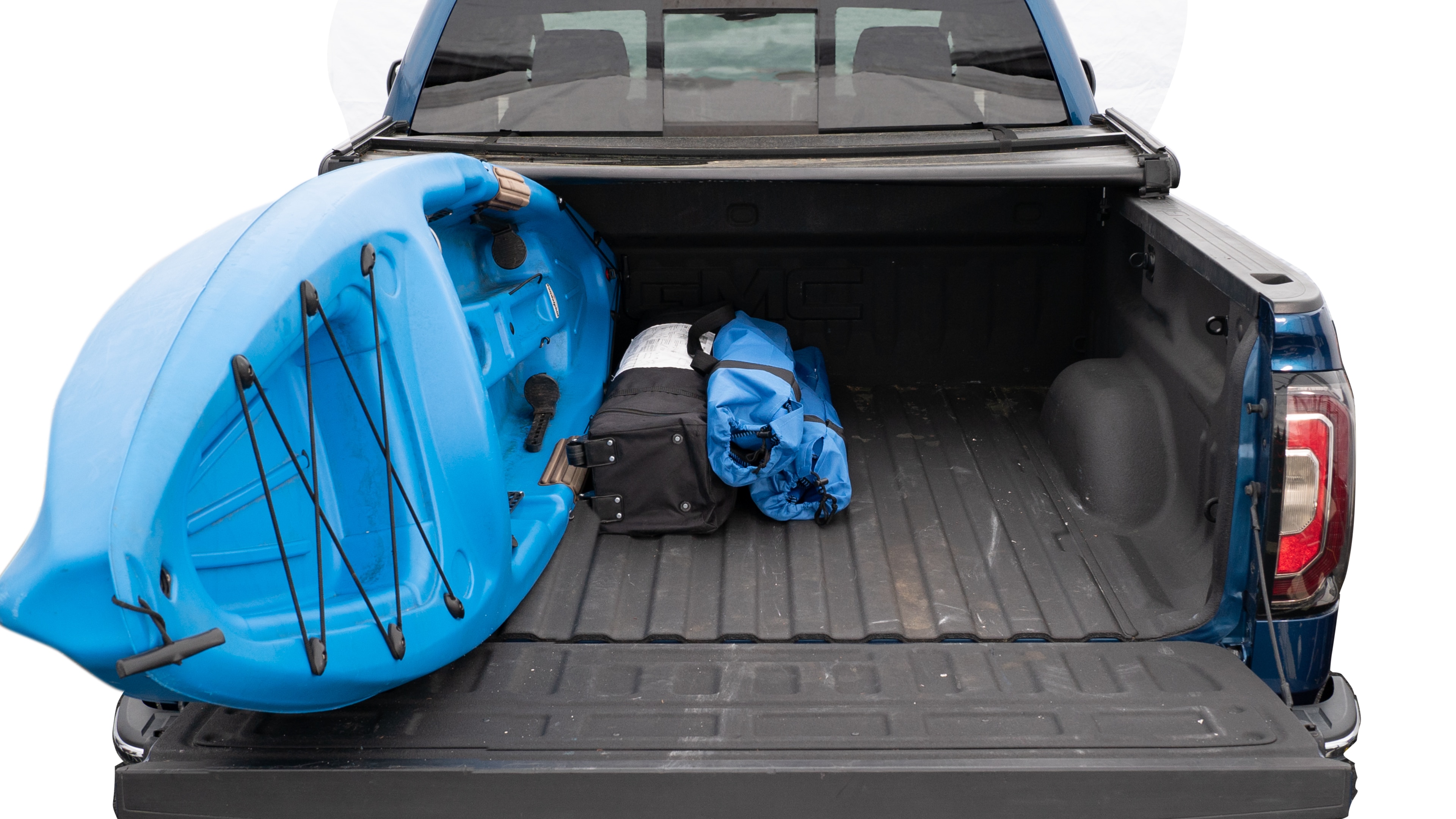 The trunk area is open giving a full view of the trunk area. A cooler, two camping chairs, a tailgate tent and a kayak are placed inside.