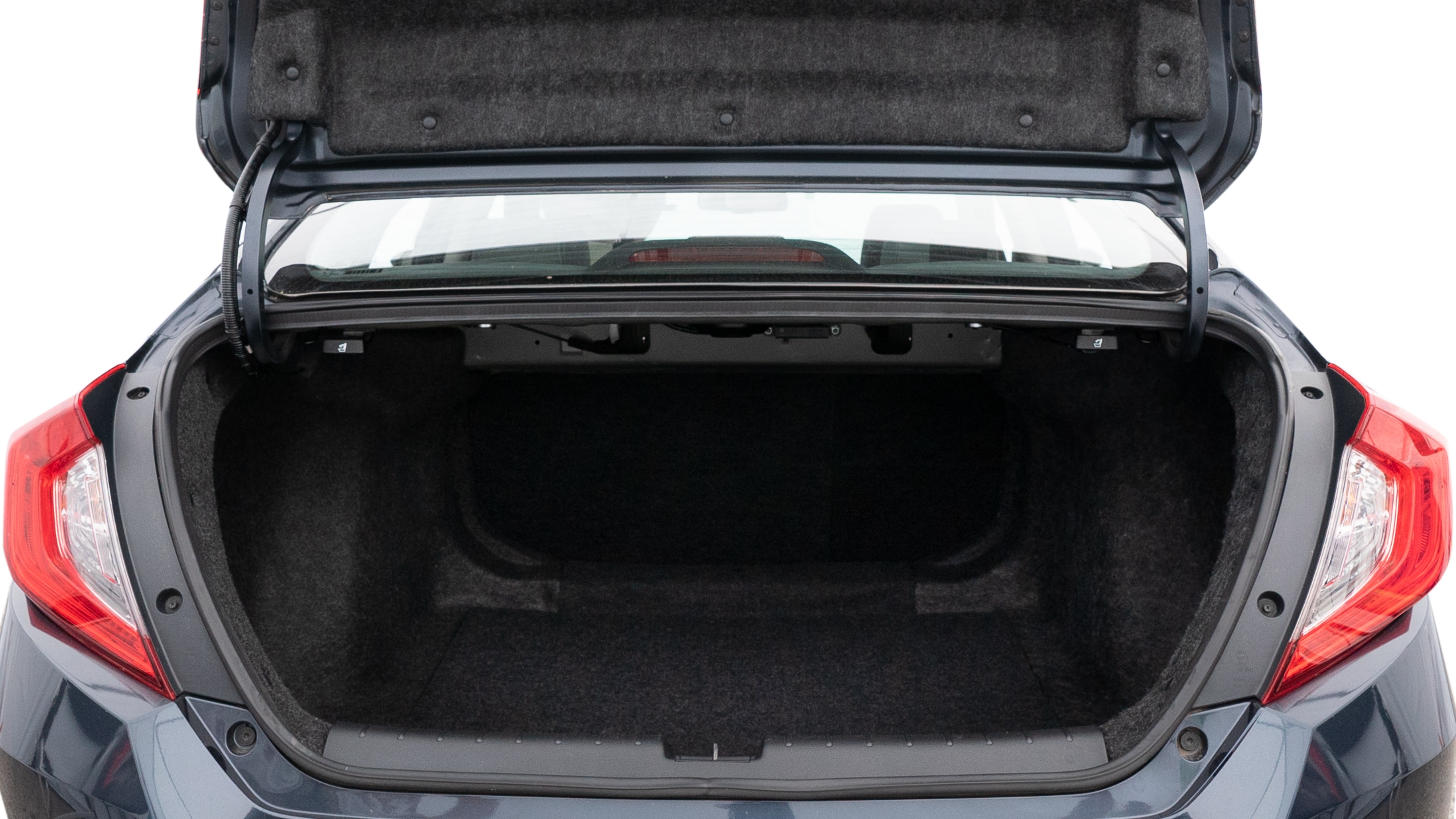 The trunk lid is open showing full view of the trunk. A baby stroller, three grocery carriers, two camping chairs in the carrying bag, and a set of golf clubs are placed inside.