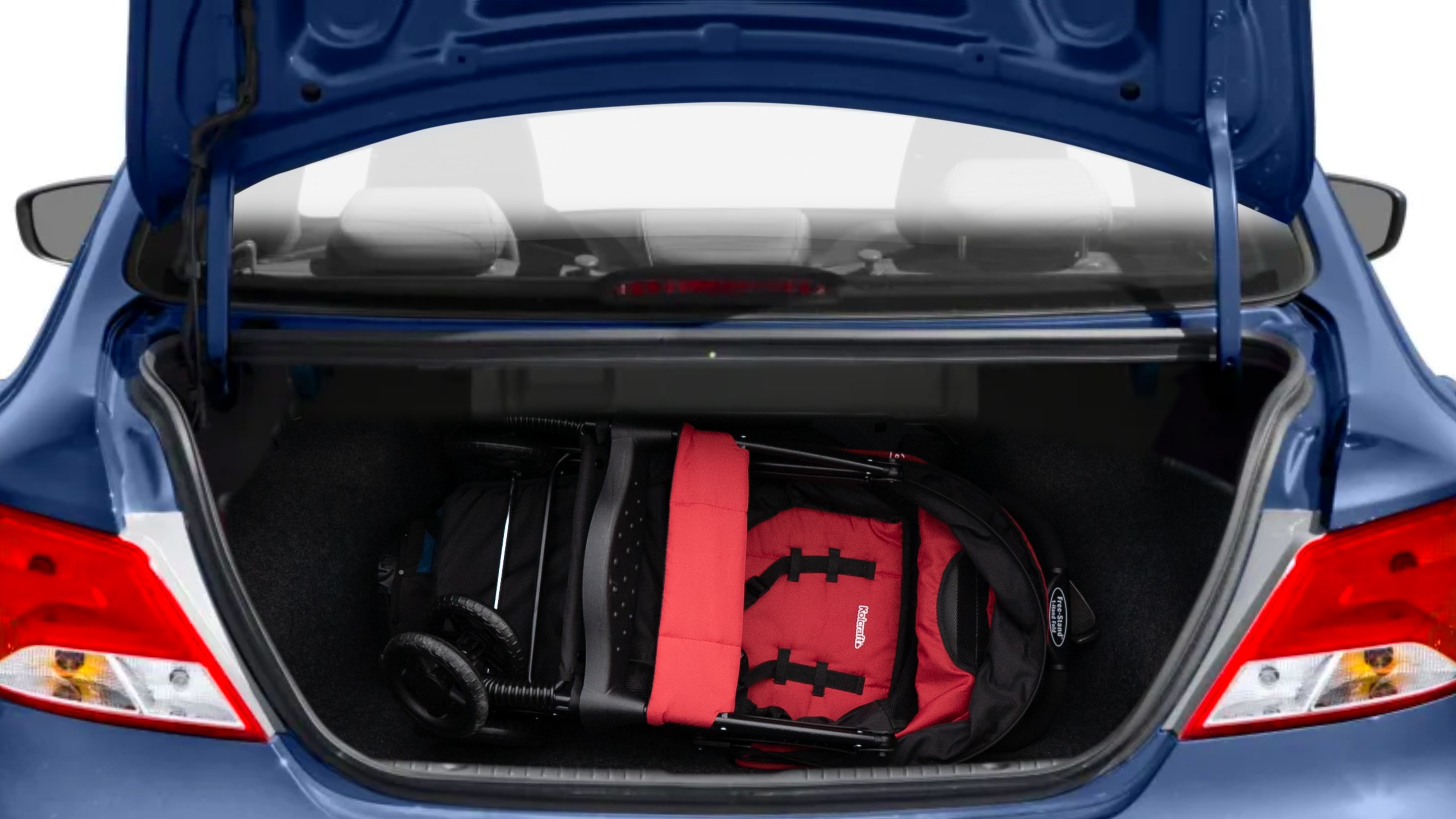 The trunk lid is open showing full view of the trunk. A baby stroller, three grocery carriers, two camping chairs in the carrying bag, and a set of golf clubs are placed inside.