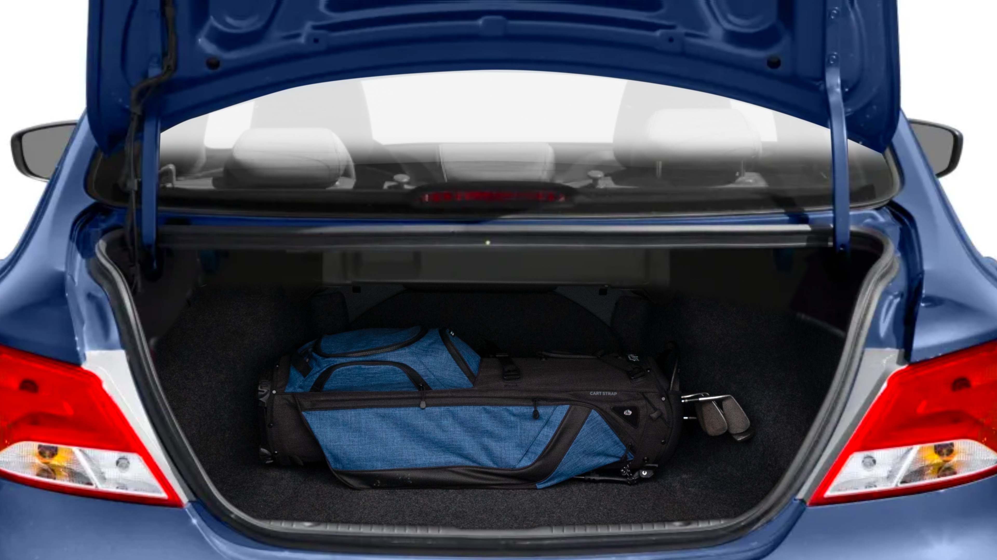 The trunk lid is open showing full view of the trunk. A baby stroller, three grocery carriers, two camping chairs in the carrying bag, and a set of golf clubs are placed inside.