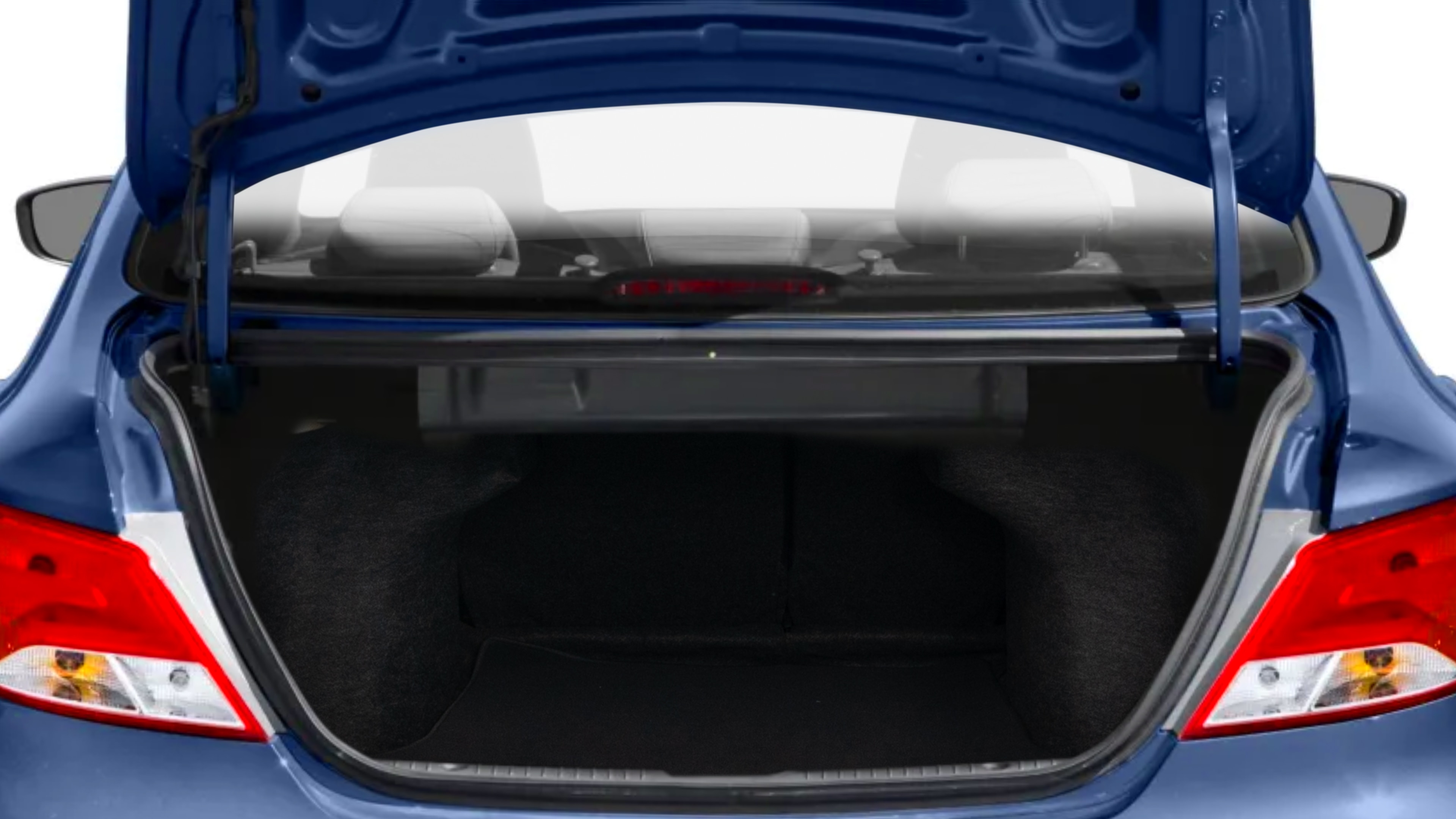 The trunk lid is open, showing full view of the trunk space. Two medium and two small suitcases are placed inside.