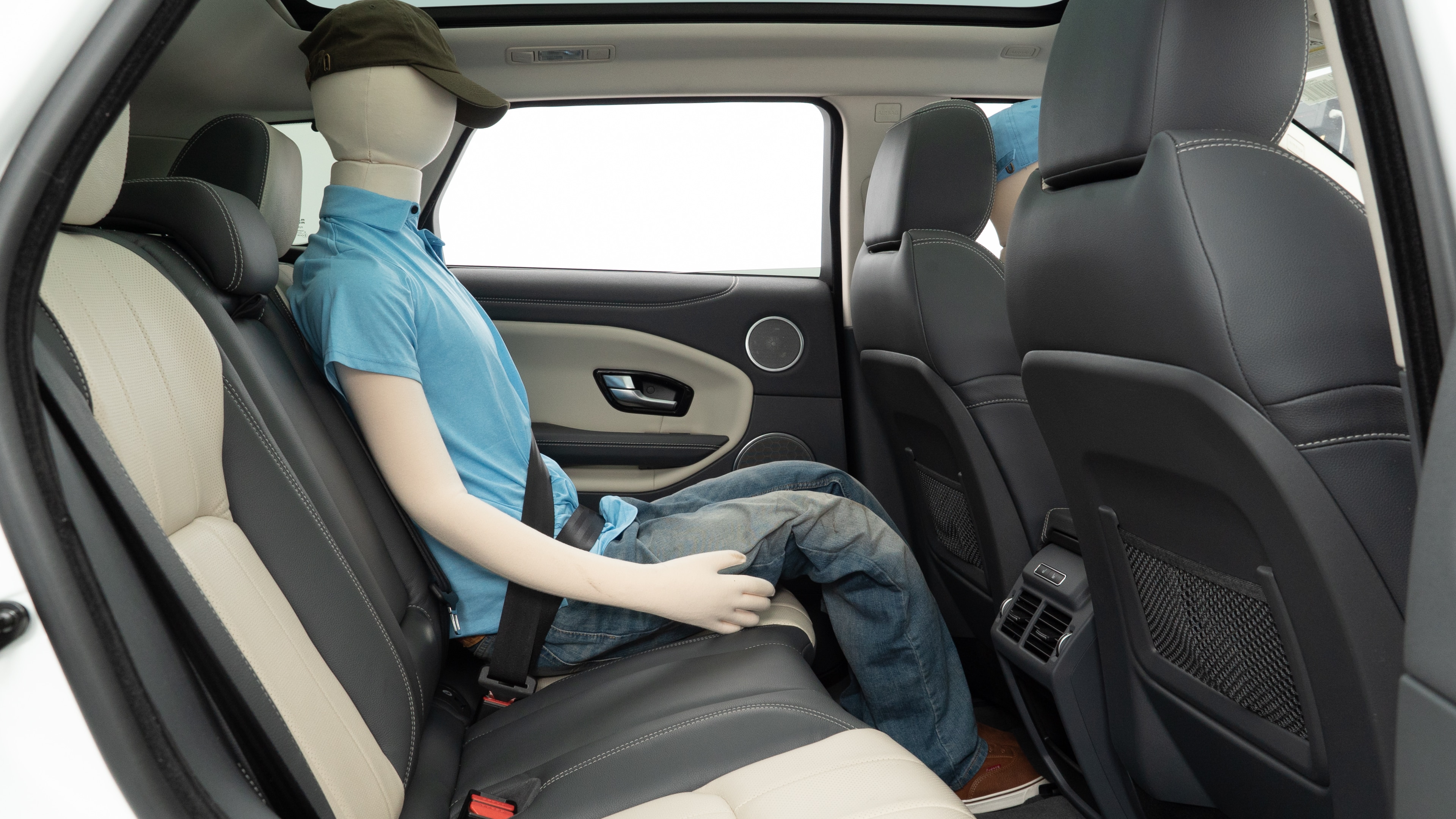 A series of second-row backseat photos is shown including one seating a baby seat and one seating a 6'1" mannequin.