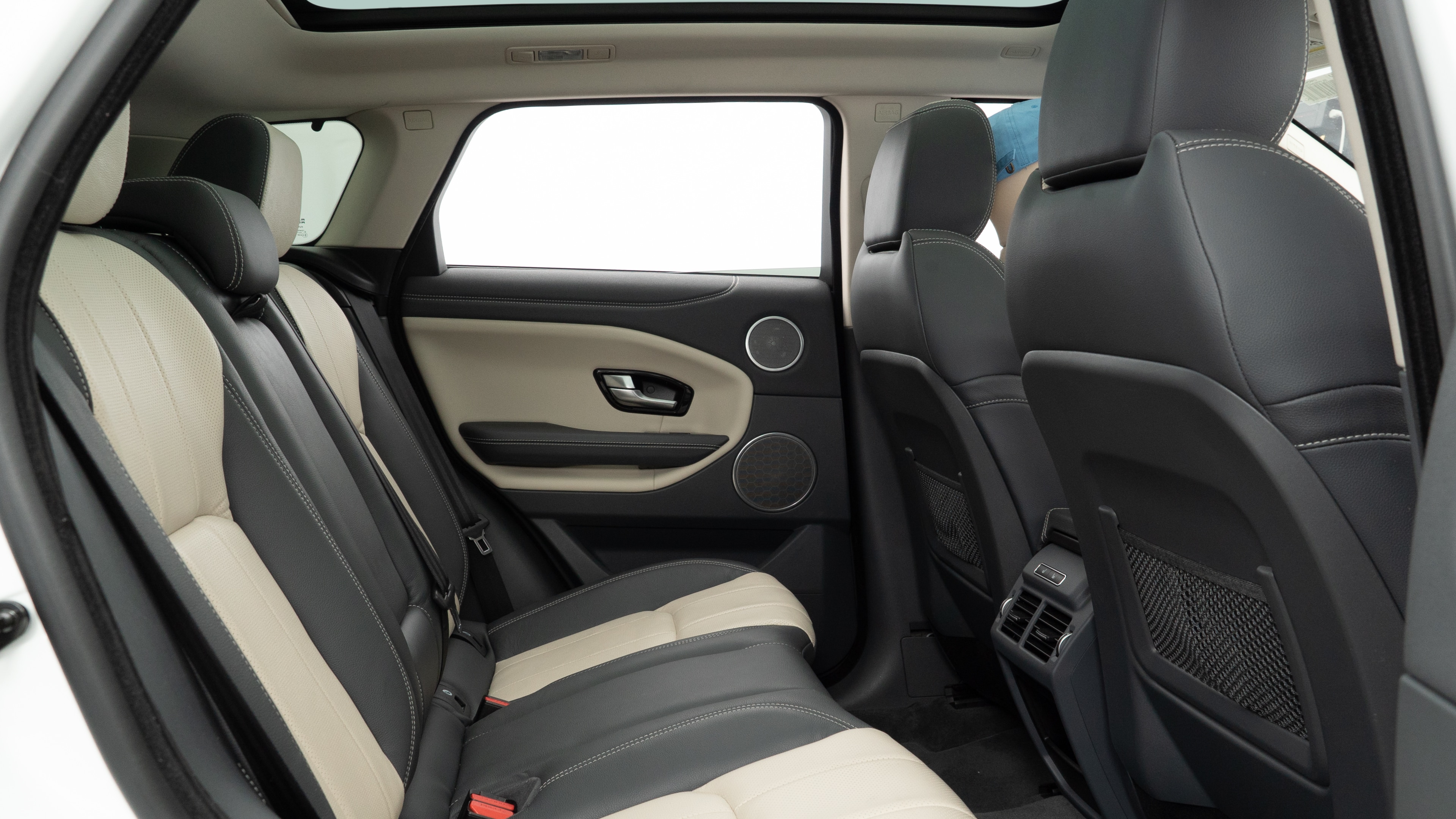 A series of second-row backseat photos is shown including one seating a baby seat and one seating a 6'1" mannequin.