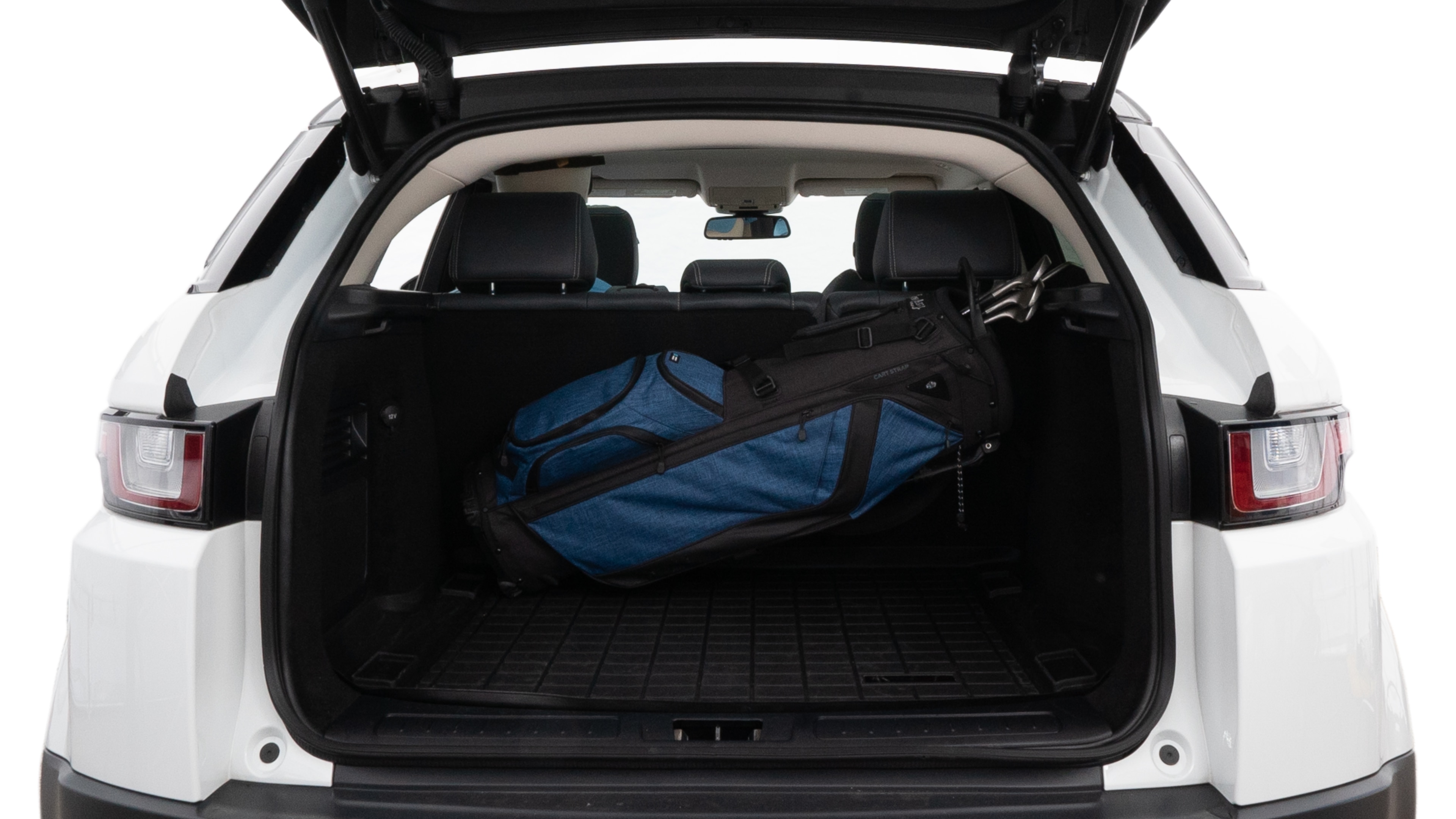 The trunk lid is open showing full view of the trunk. A baby stroller, three grocery carriers, two camping chairs in the carrying bag, and a set of golf clubs are placed inside.