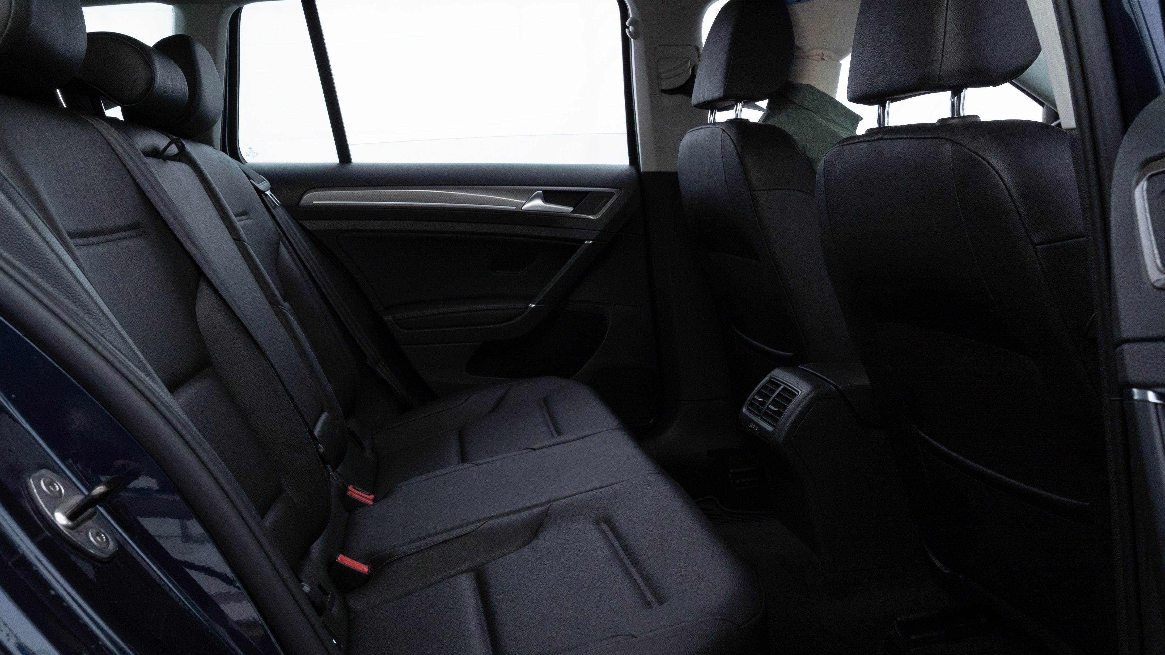 A series of second-row backseat photos is shown including one seating a baby seat and one seating a 6'1" mannequin.