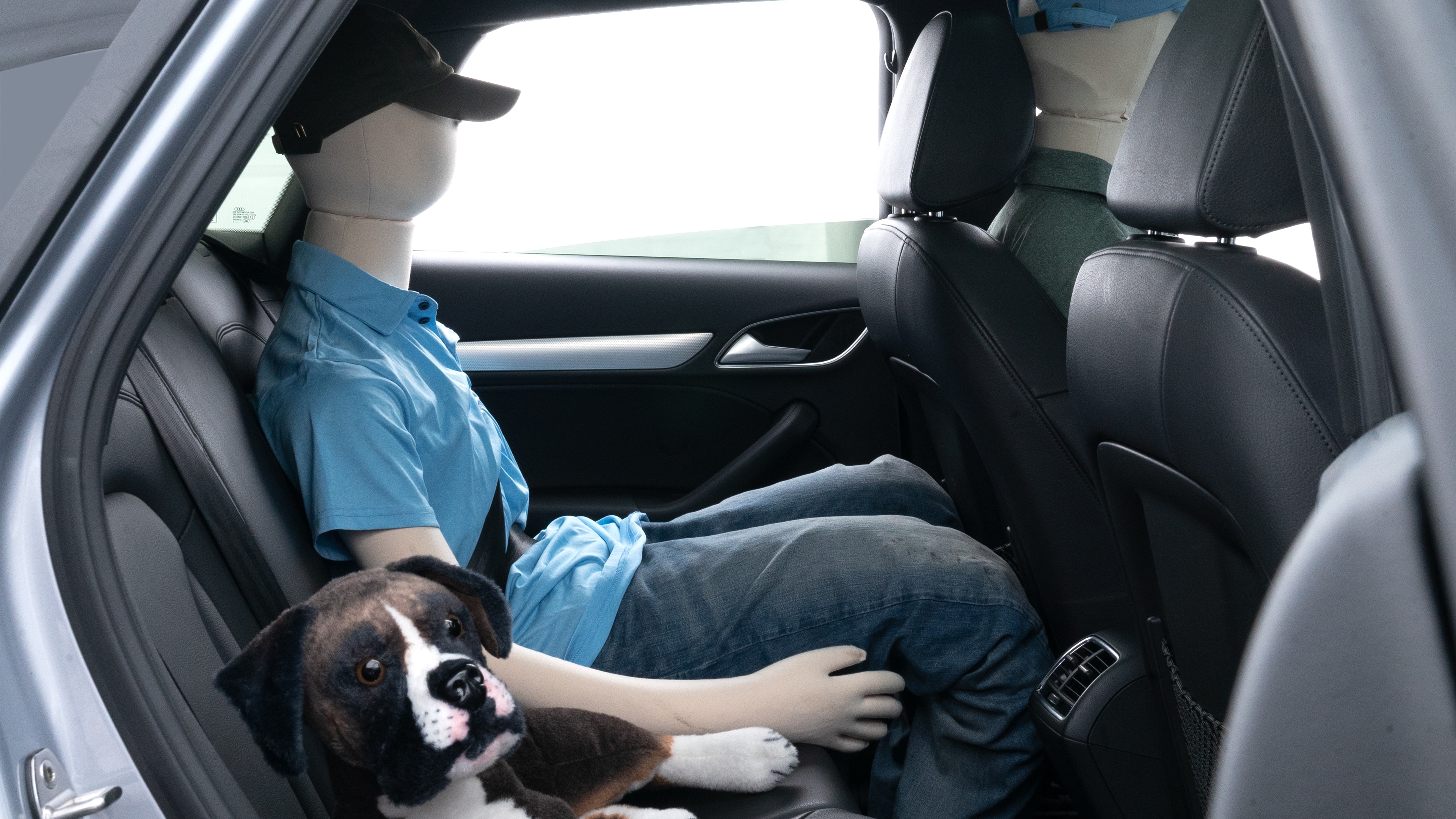 A series of second-row backseat photos is shown including one seating a baby seat and one seating a 6'1" mannequin.