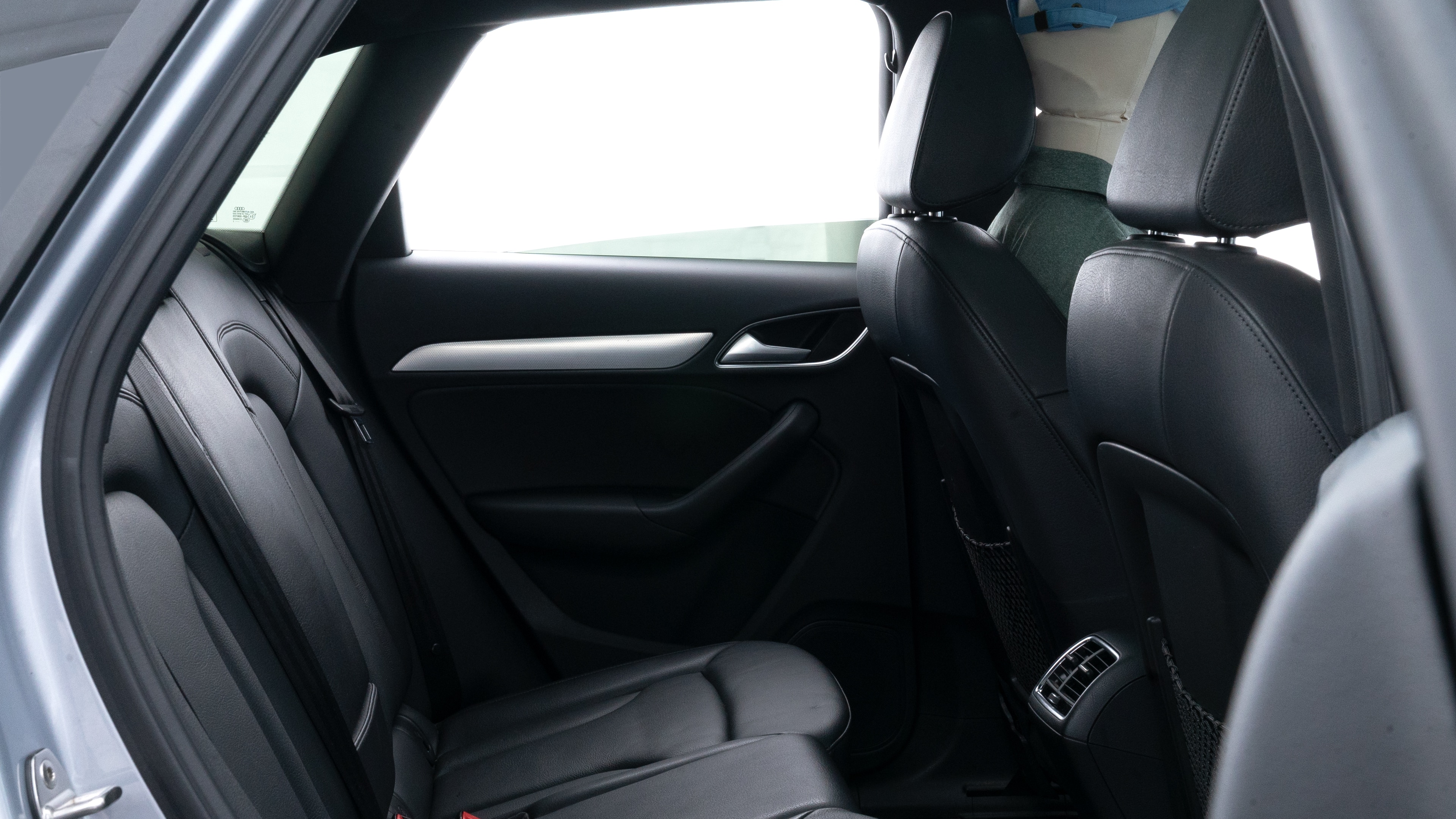 A series of second-row backseat photos is shown including one seating a baby seat and one seating a 6'1" mannequin.
