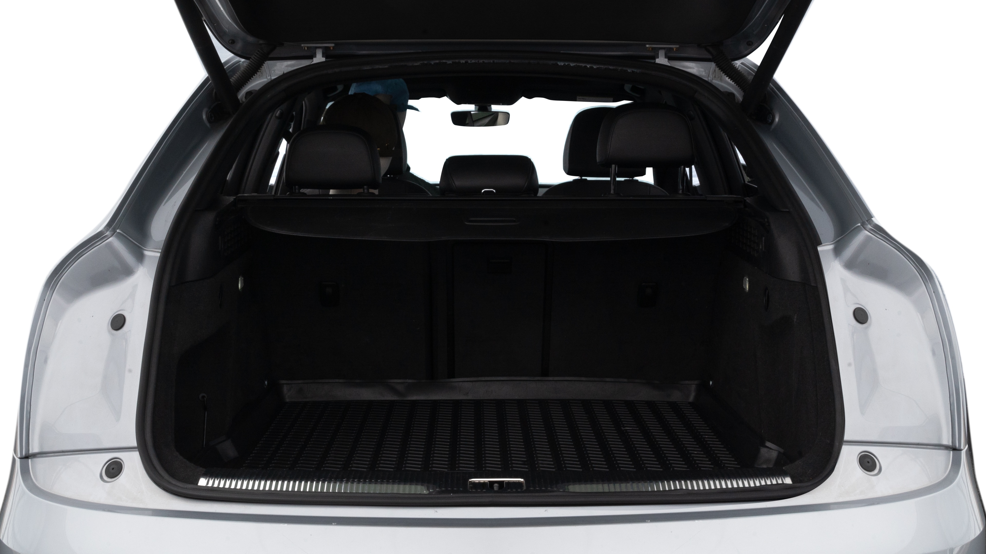 The trunk lid is open showing full view of the trunk. A baby stroller, three grocery carriers, two camping chairs in the carrying bag, and a set of golf clubs are placed inside.