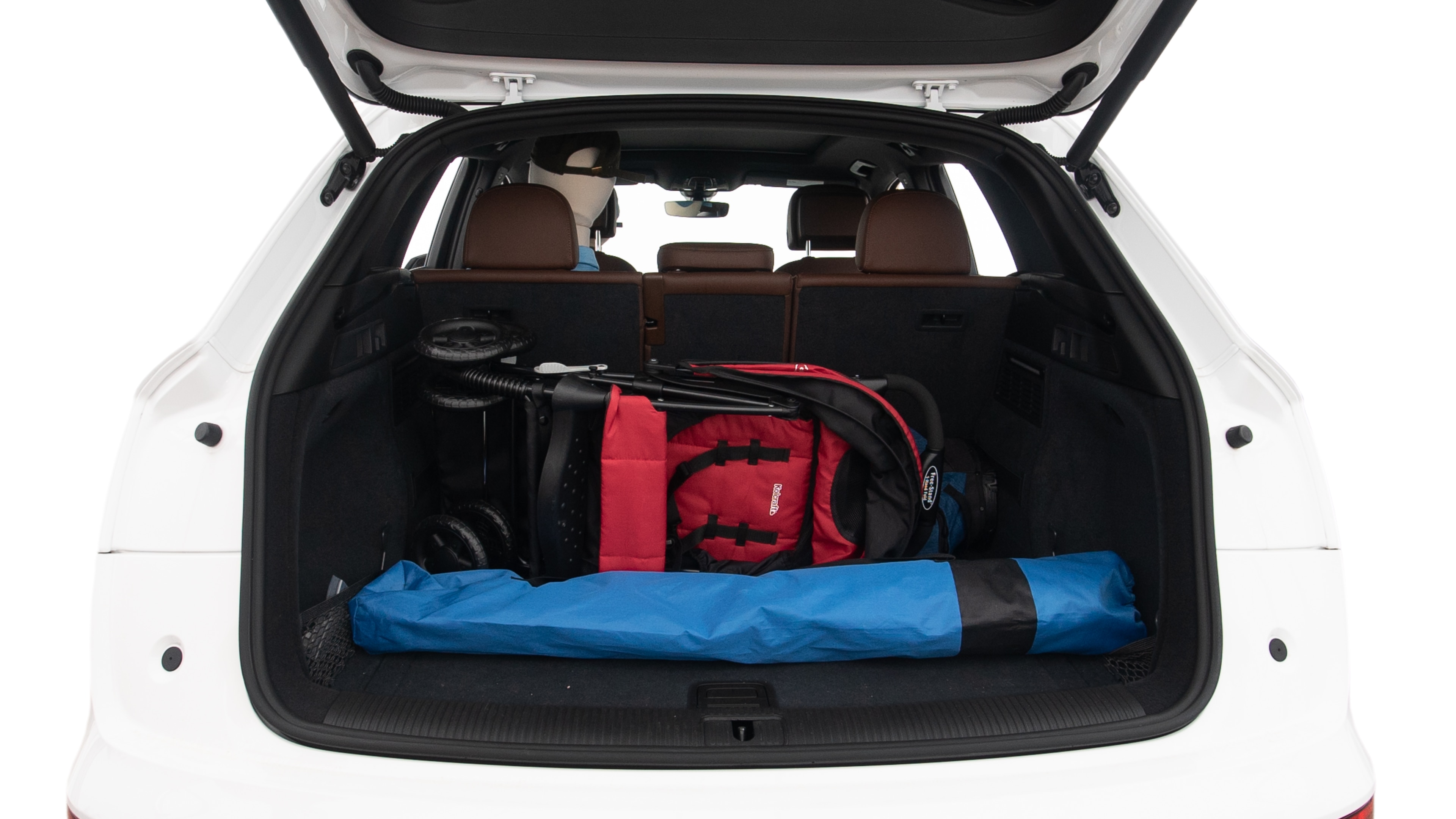 The trunk lid is open showing full view of the trunk. A baby stroller, three grocery carriers, two camping chairs in the carrying bag, and a set of golf clubs are placed inside.