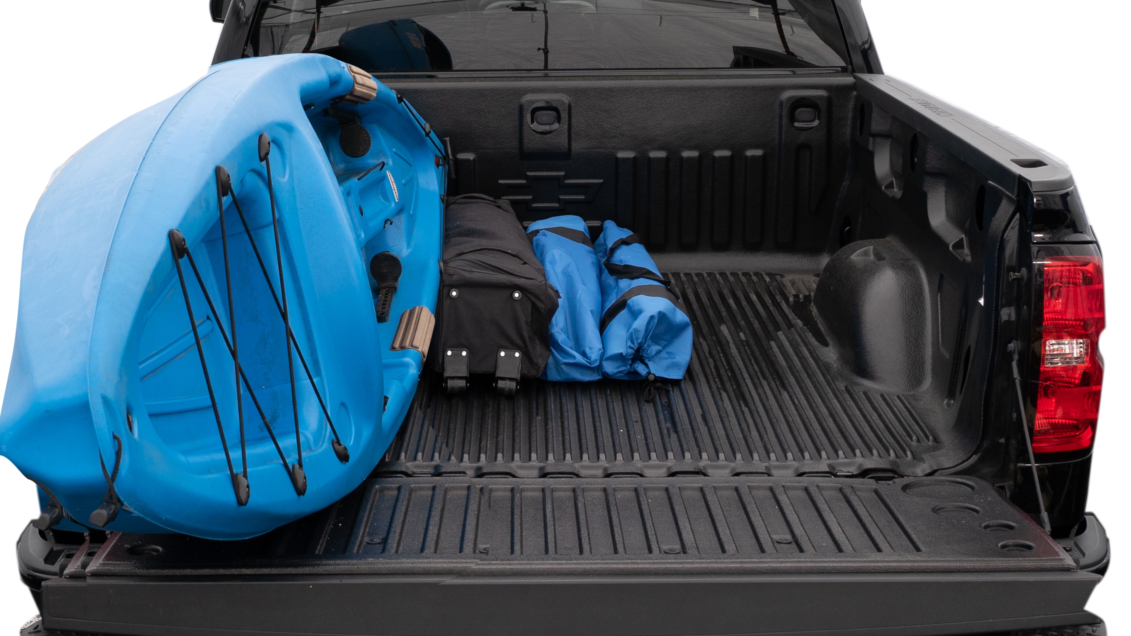 The trunk area is open giving a full view of the trunk area. A cooler, two camping chairs, a tailgate tent and a kayak are placed inside.