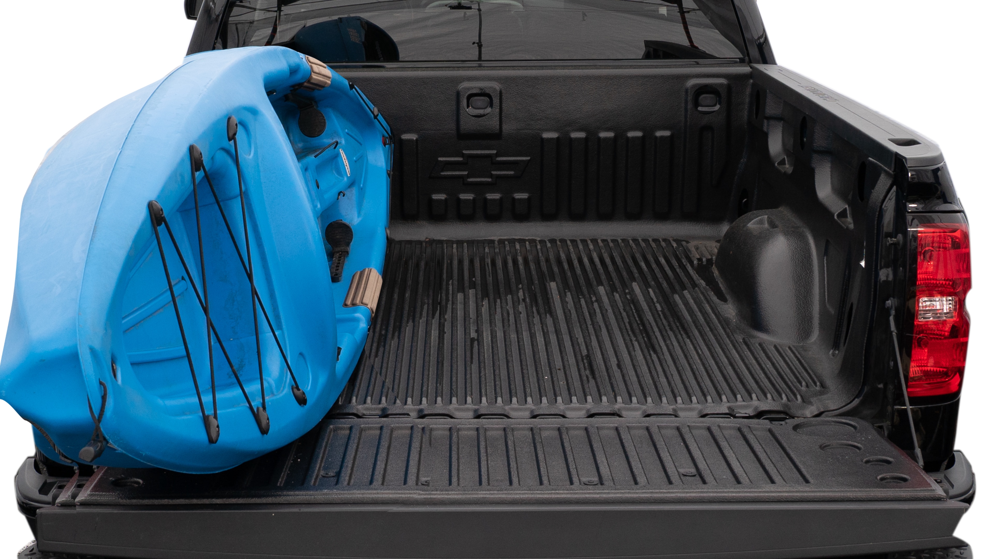 The trunk area is open giving a full view of the trunk area. A cooler, two camping chairs, a tailgate tent and a kayak are placed inside.