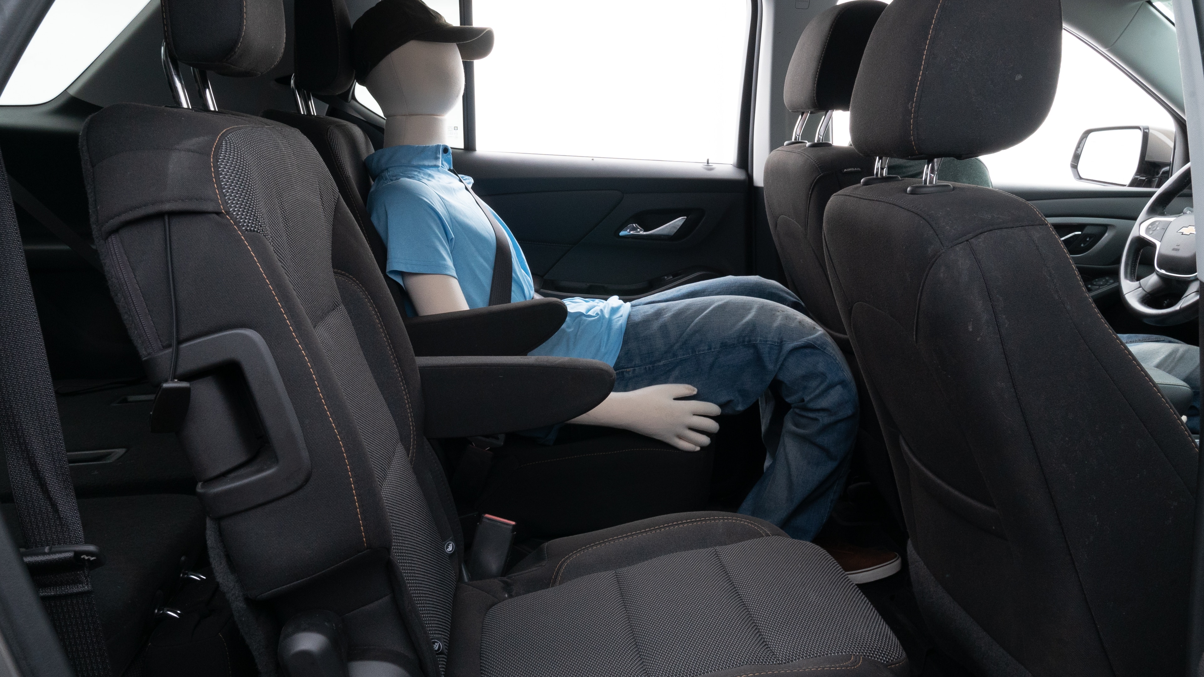 A series of second-row backseat photos is shown including one seating a baby seat and one seating a 6'1" mannequin.