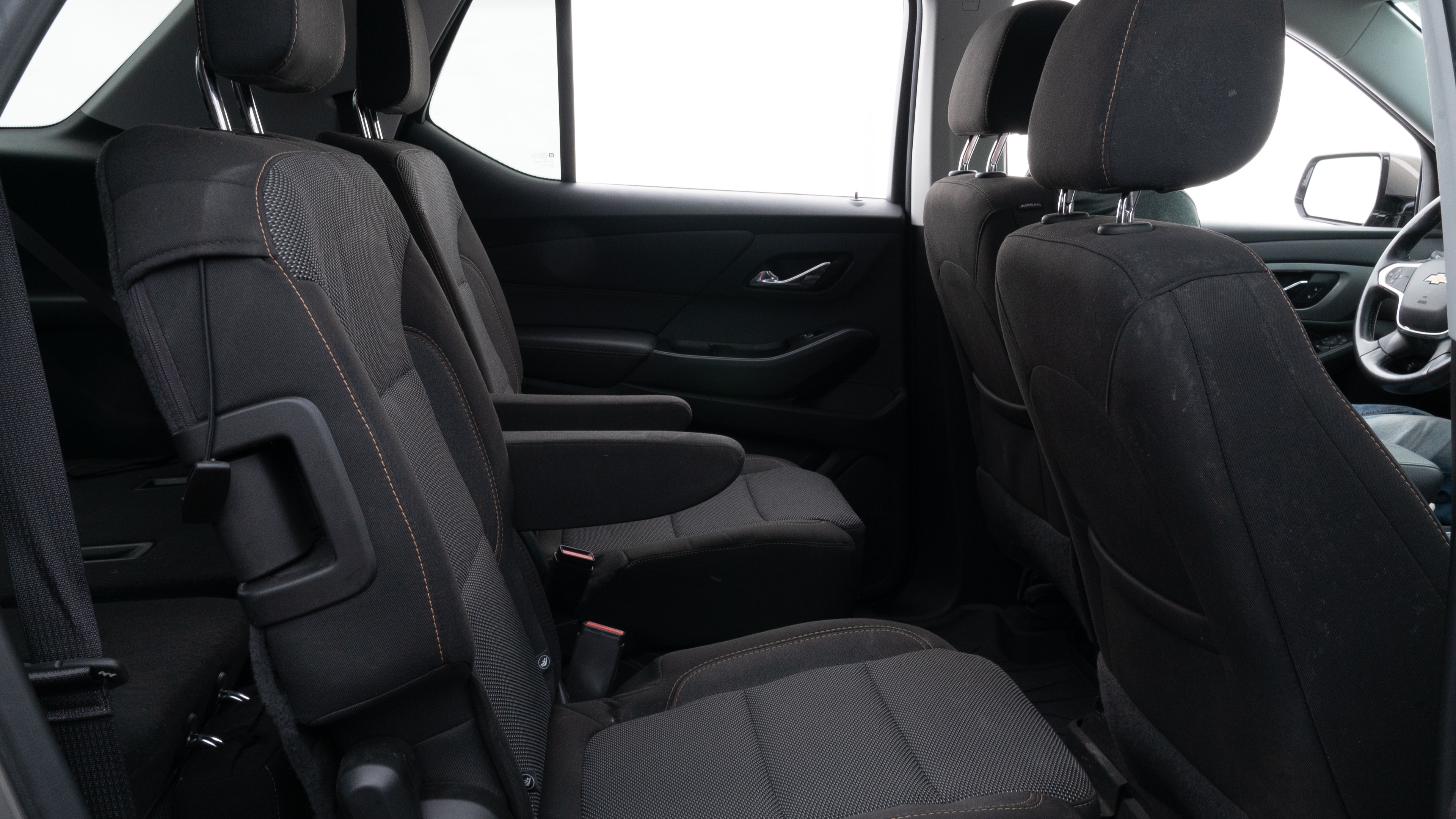 A series of second-row backseat photos is shown including one seating a baby seat and one seating a 6'1" mannequin.