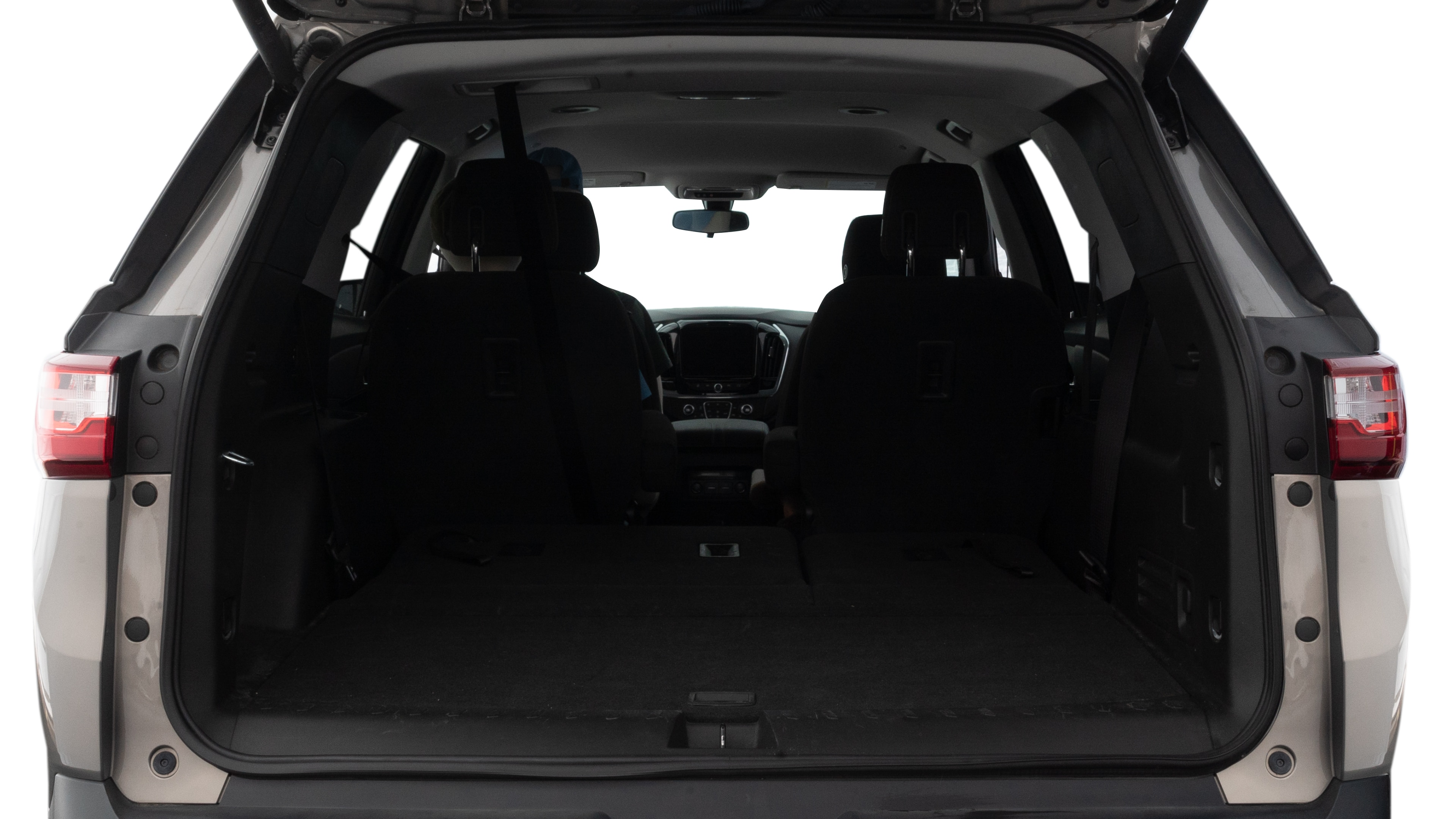 The trunk lid is open showing full view of the trunk. A baby stroller, three grocery carriers, two camping chairs in the carrying bag, and a set of golf clubs are placed inside.