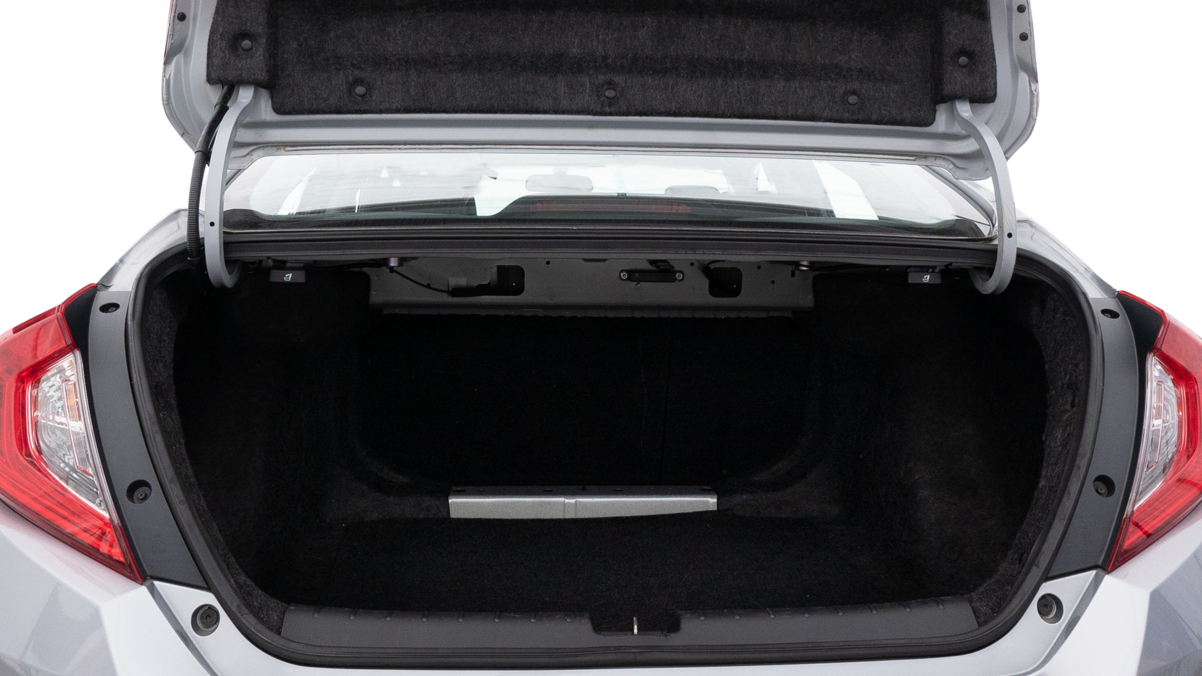 The trunk lid is open showing full view of the trunk. A baby stroller, three grocery carriers, two camping chairs in the carrying bag, and a set of golf clubs are placed inside.