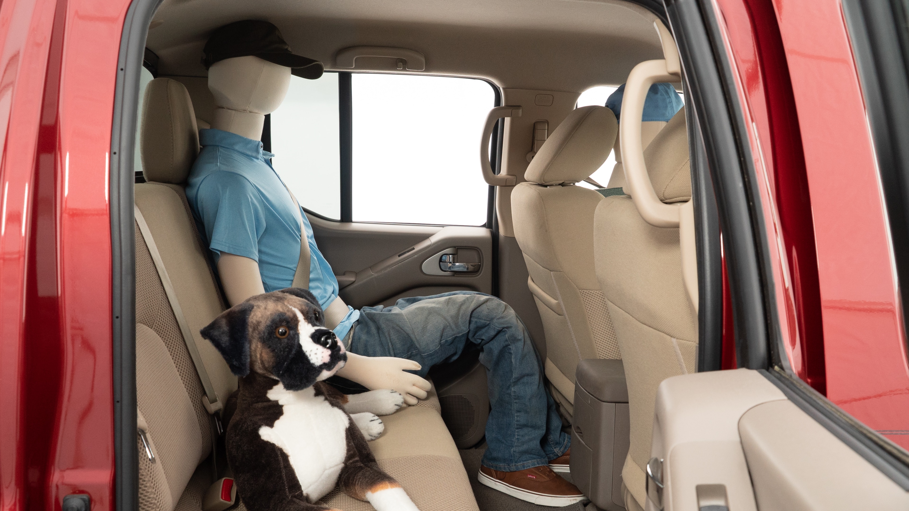 A series of second-row backseat photos is shown including one seating a baby seat and one seating a 6'1" mannequin.