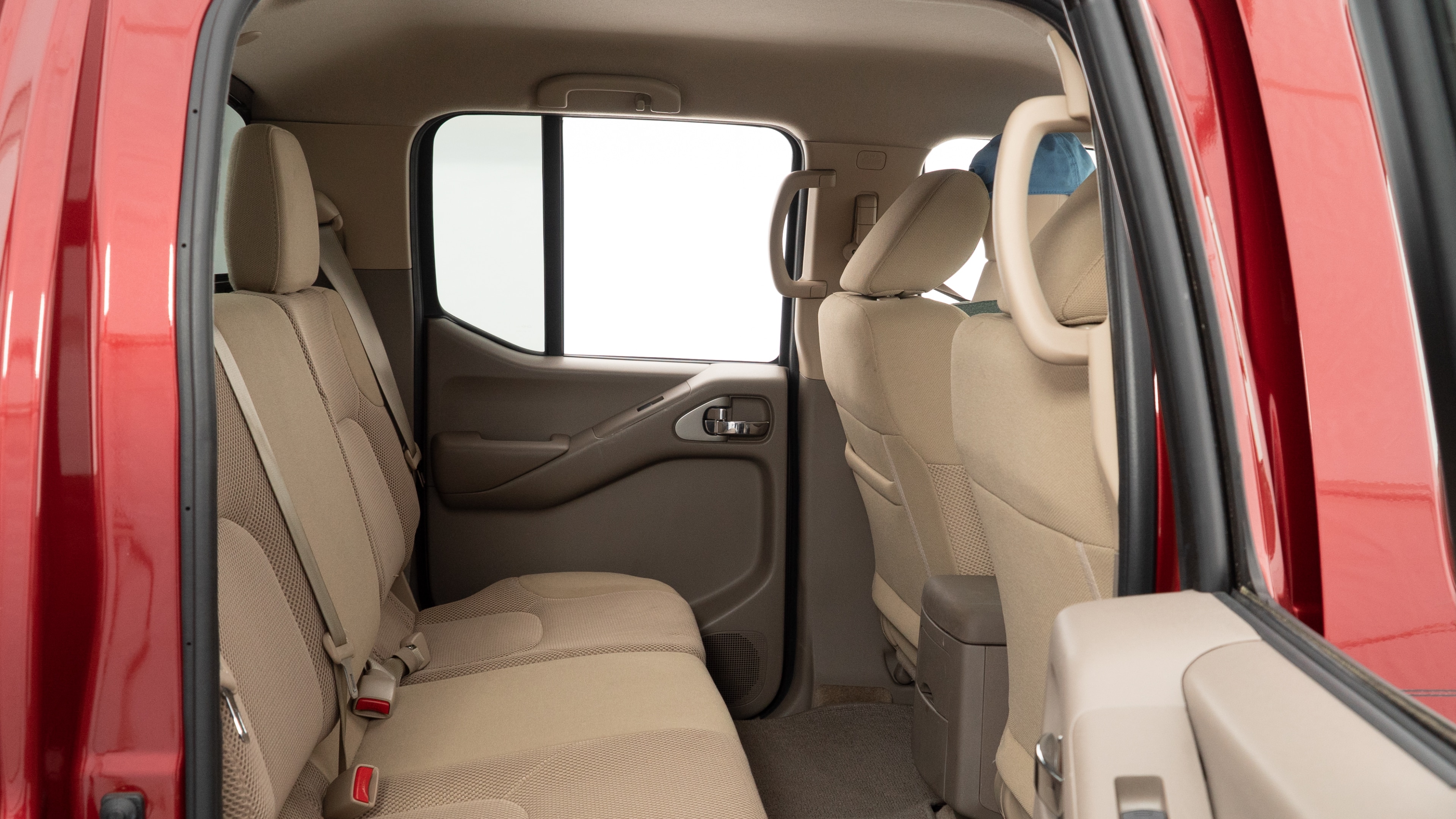 A series of second-row backseat photos is shown including one seating a baby seat and one seating a 6'1" mannequin.