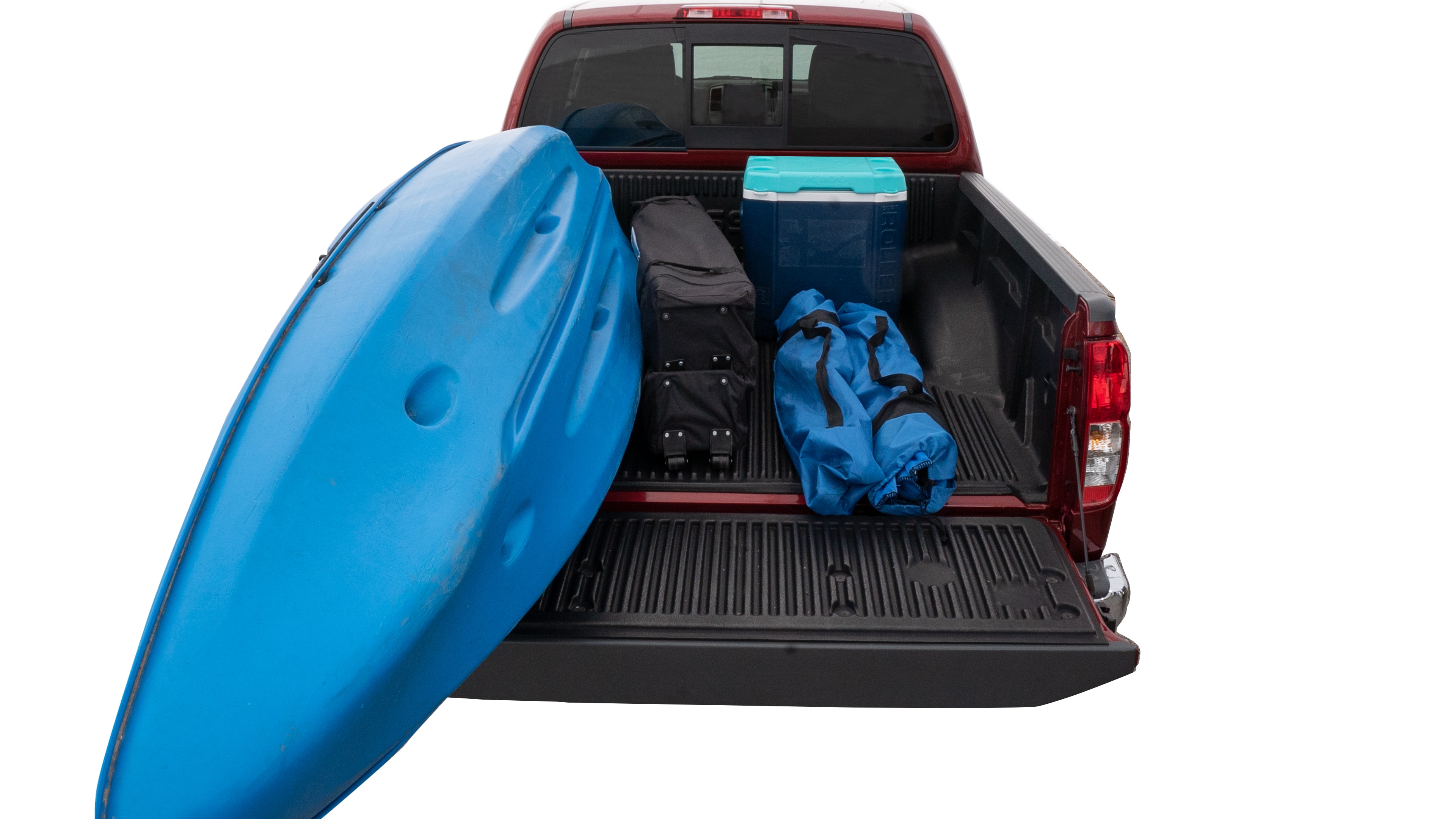 The trunk area is open giving a full view of the trunk area. A cooler, two camping chairs, a tailgate tent and a kayak are placed inside. 