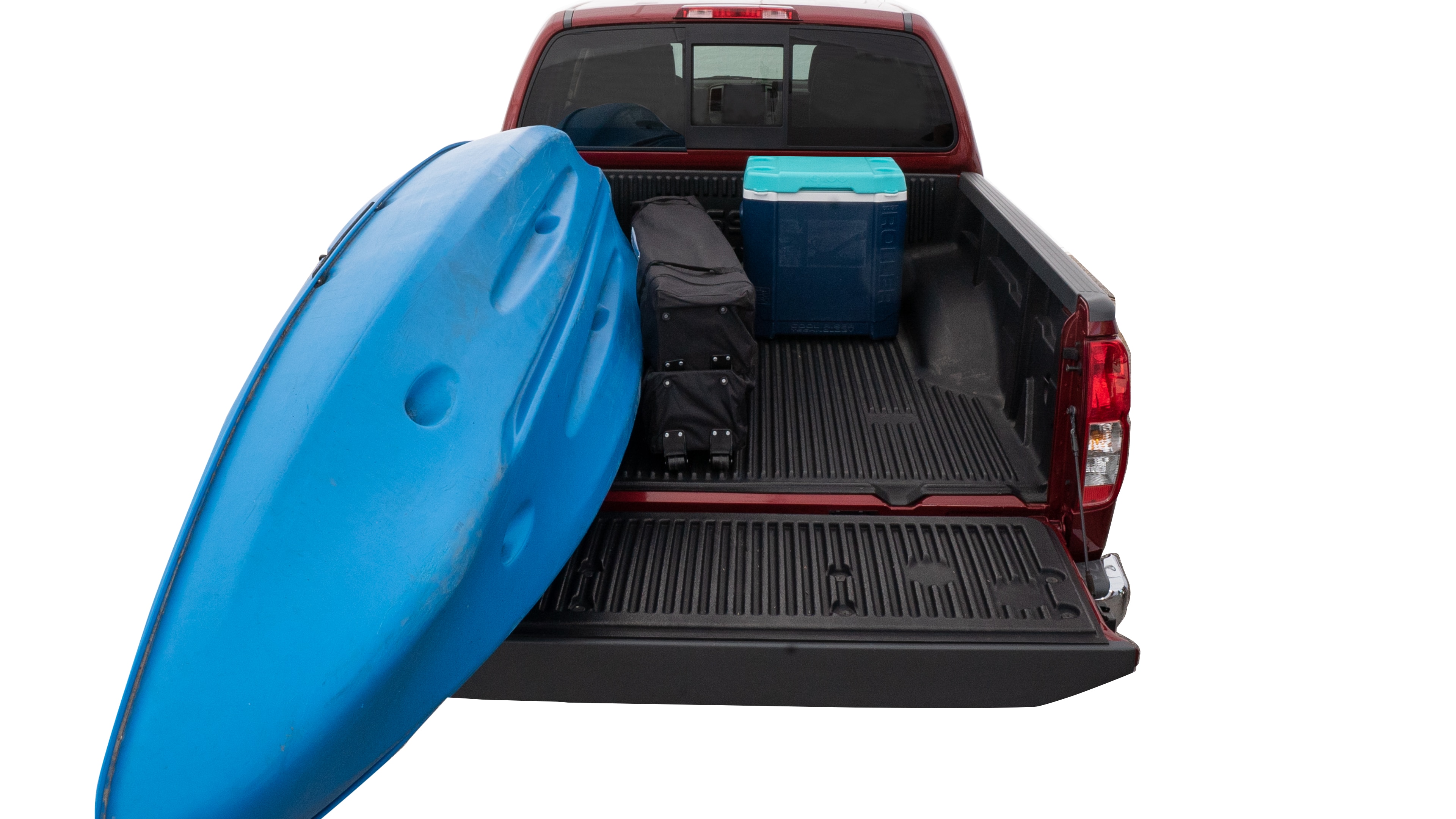 The trunk area is open giving a full view of the trunk area. A cooler, two camping chairs, a tailgate tent and a kayak are placed inside. 