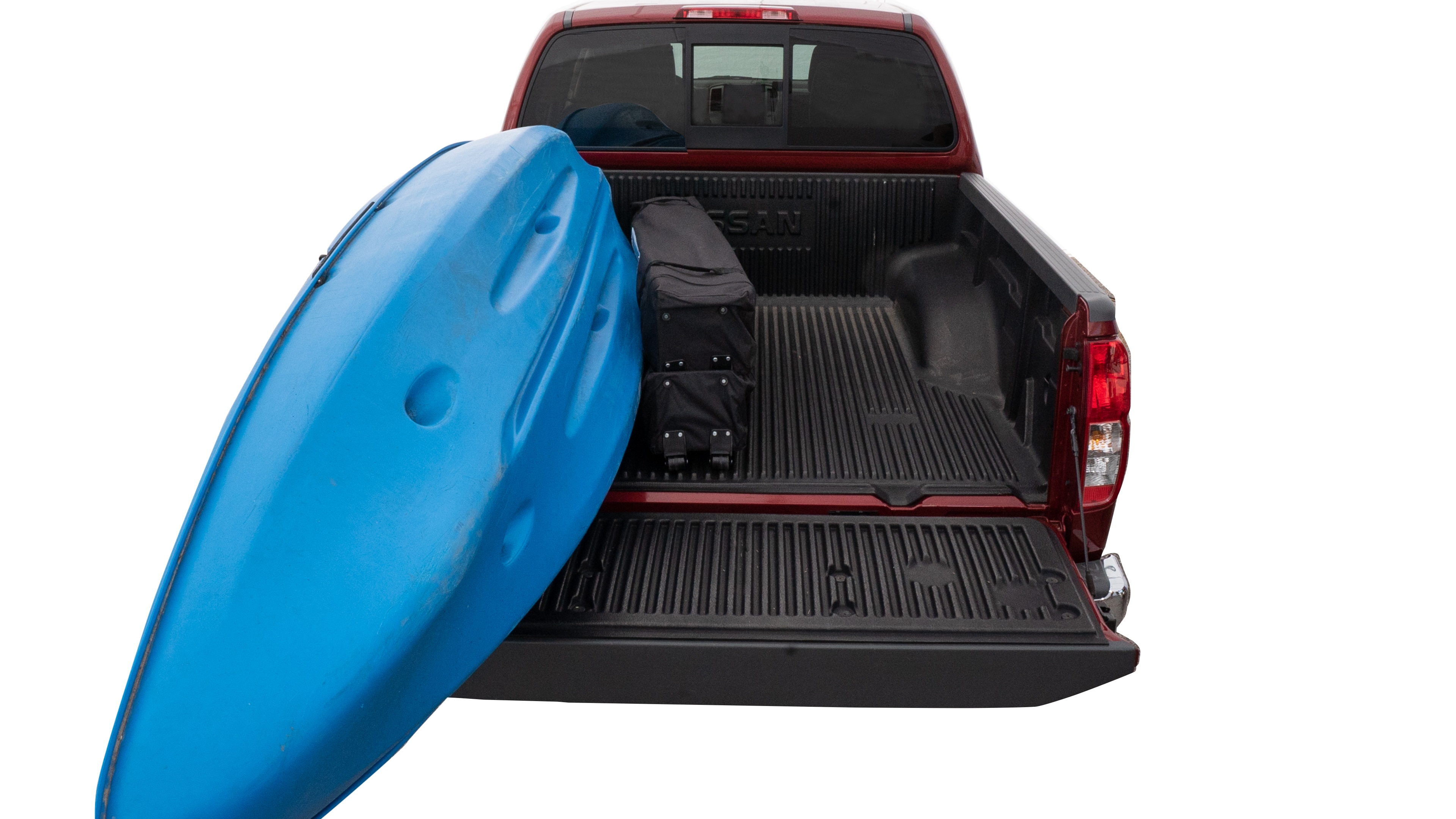 The trunk area is open giving a full view of the trunk area. A cooler, two camping chairs, a tailgate tent and a kayak are placed inside. 