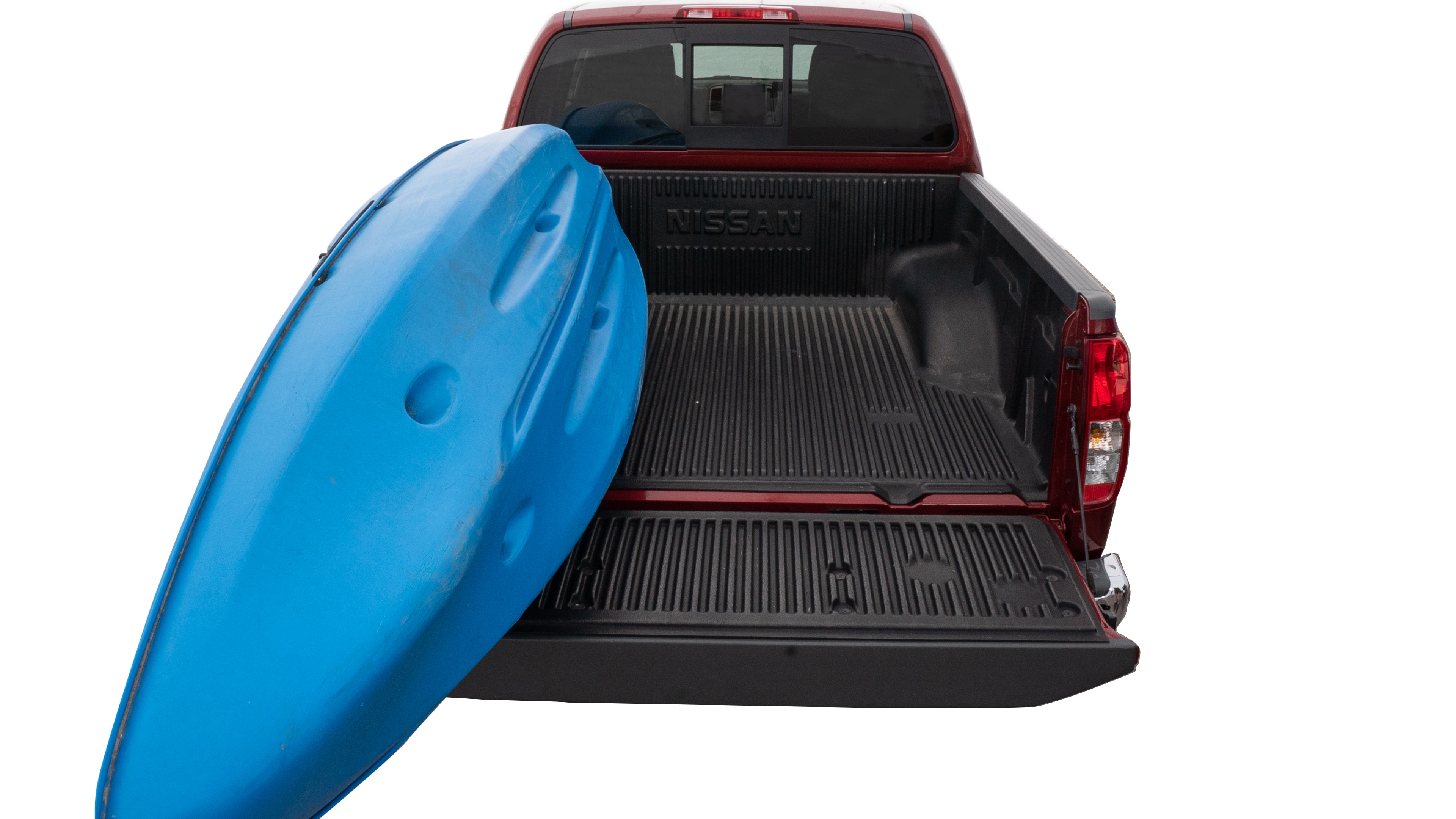 The trunk area is open giving a full view of the trunk area. A cooler, two camping chairs, a tailgate tent and a kayak are placed inside. 