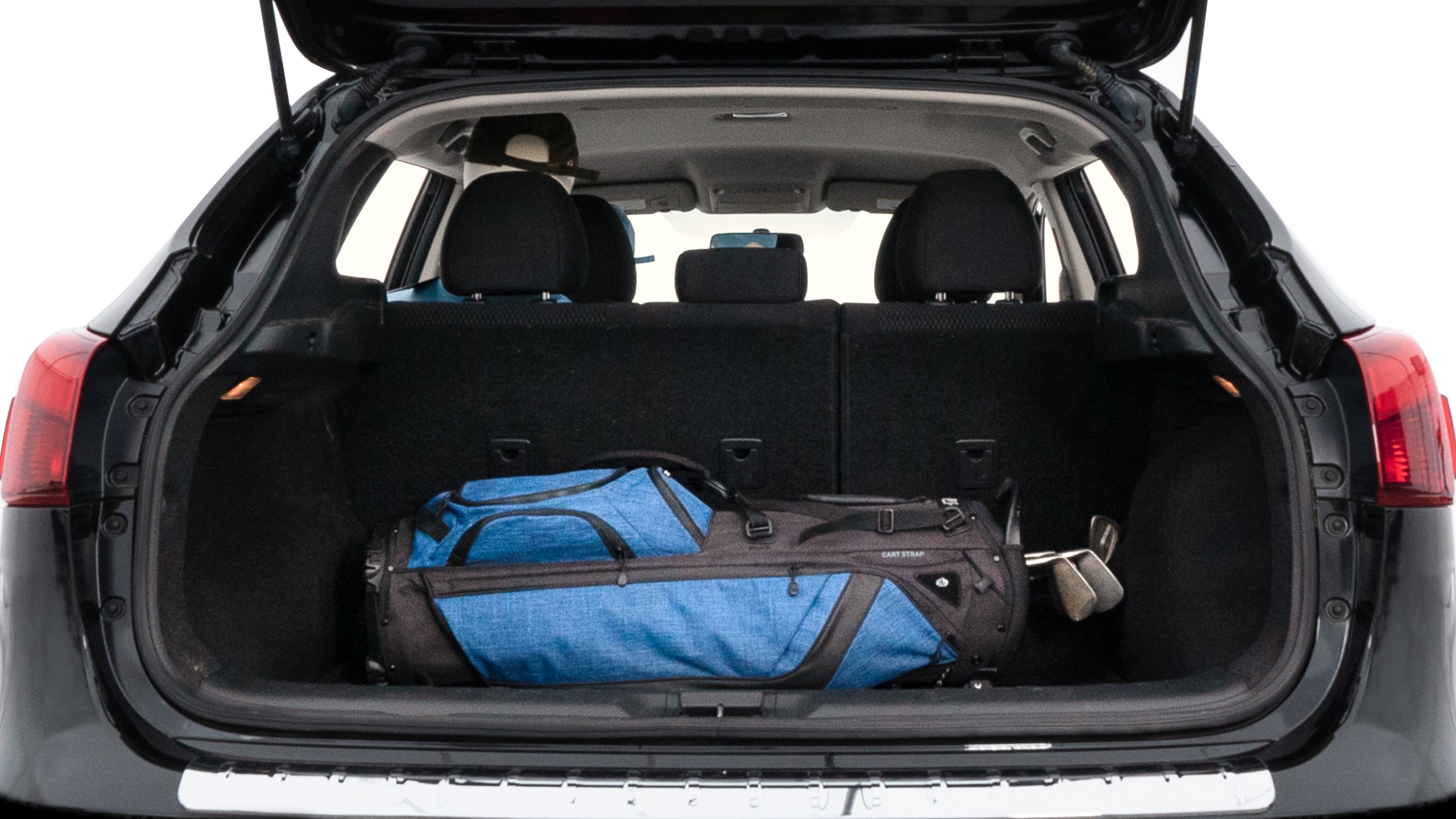 The trunk lid is open showing full view of the trunk. A baby stroller, three grocery carriers, two camping chairs in the carrying bag, and a set of golf clubs are placed inside.
