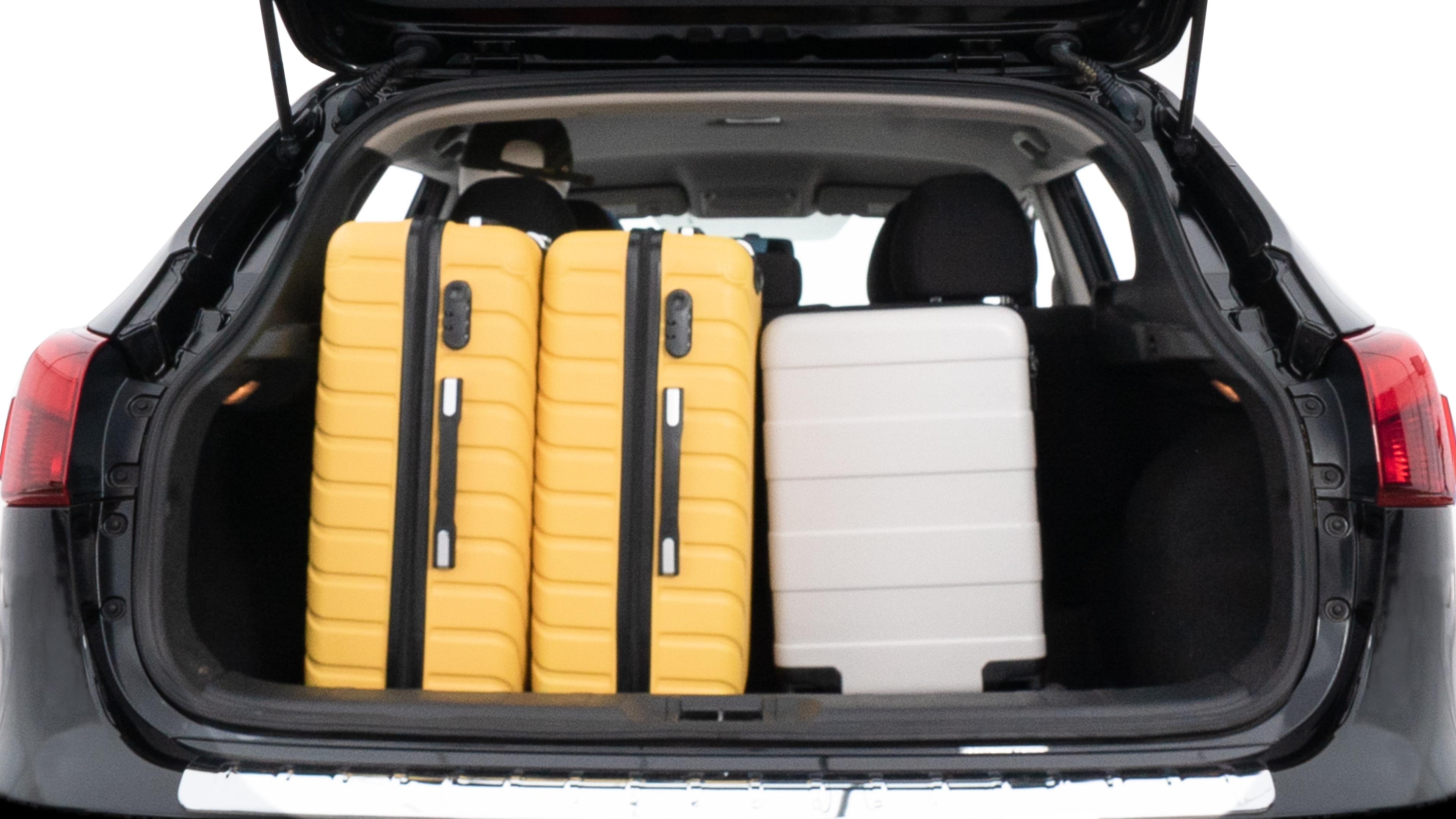 The trunk lid is open, showing full view of the trunk space. Two medium and two small suitcases are placed inside.