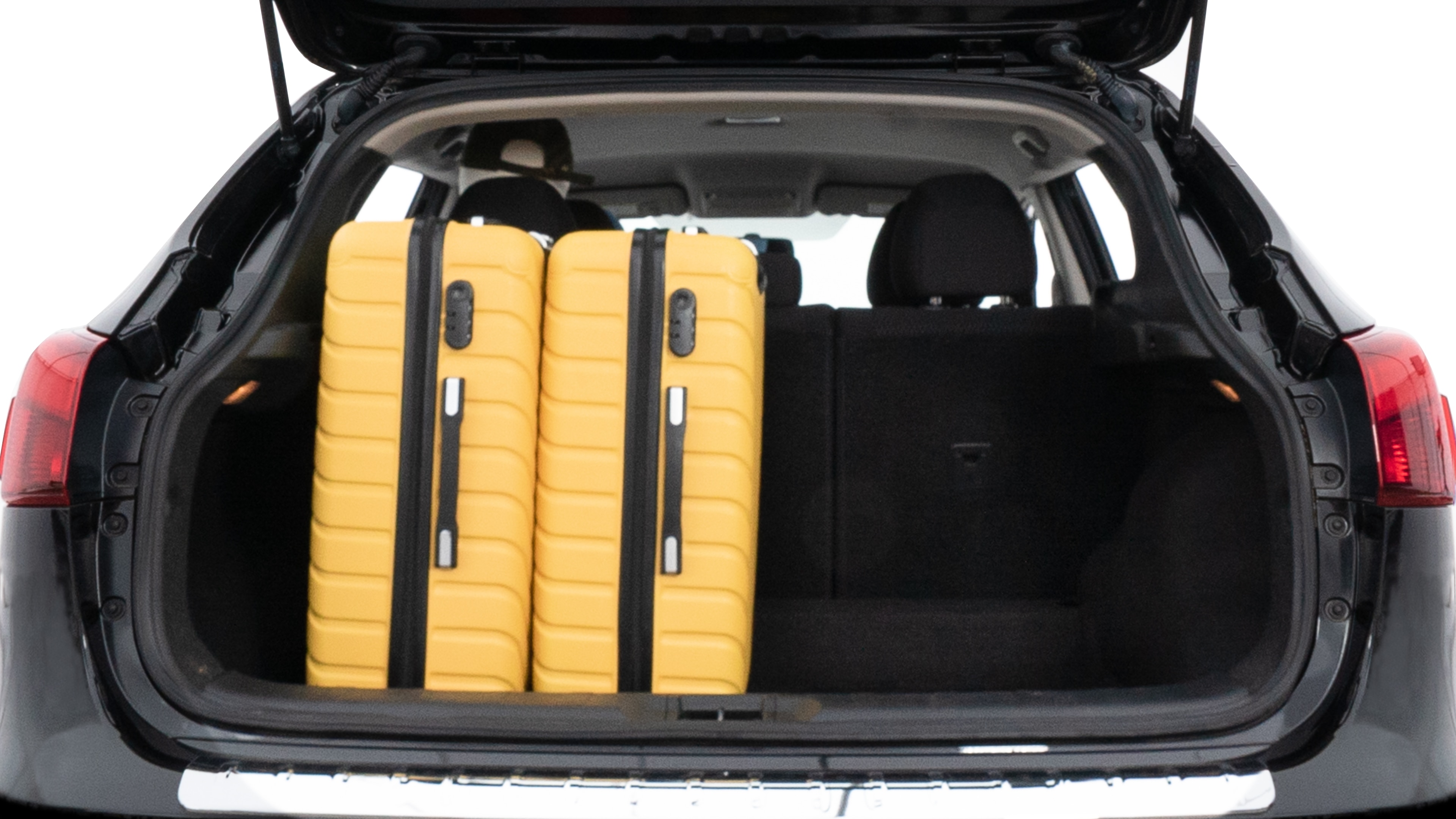 The trunk lid is open, showing full view of the trunk space. Two medium and two small suitcases are placed inside.