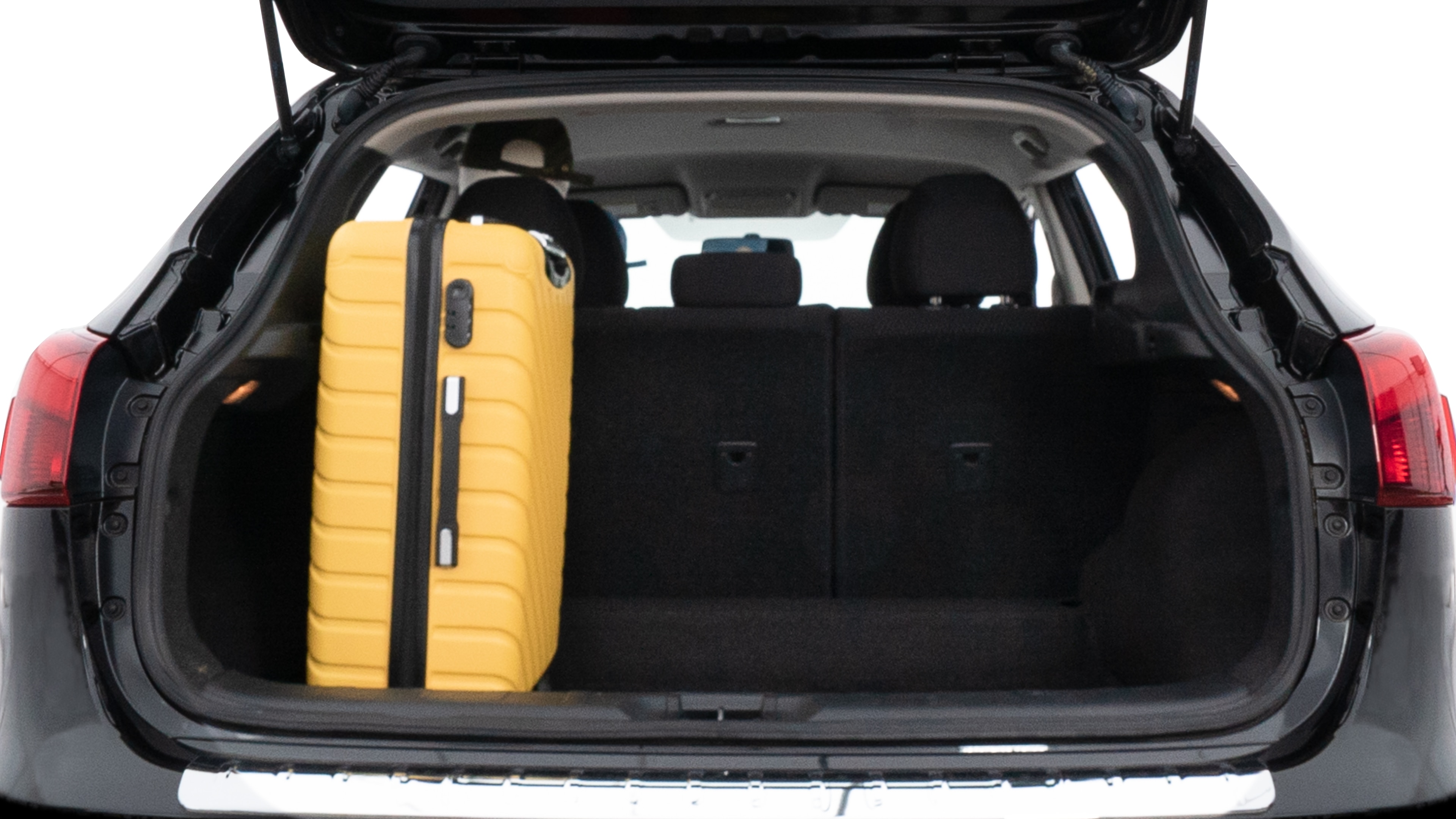 The trunk lid is open, showing full view of the trunk space. Two medium and two small suitcases are placed inside.