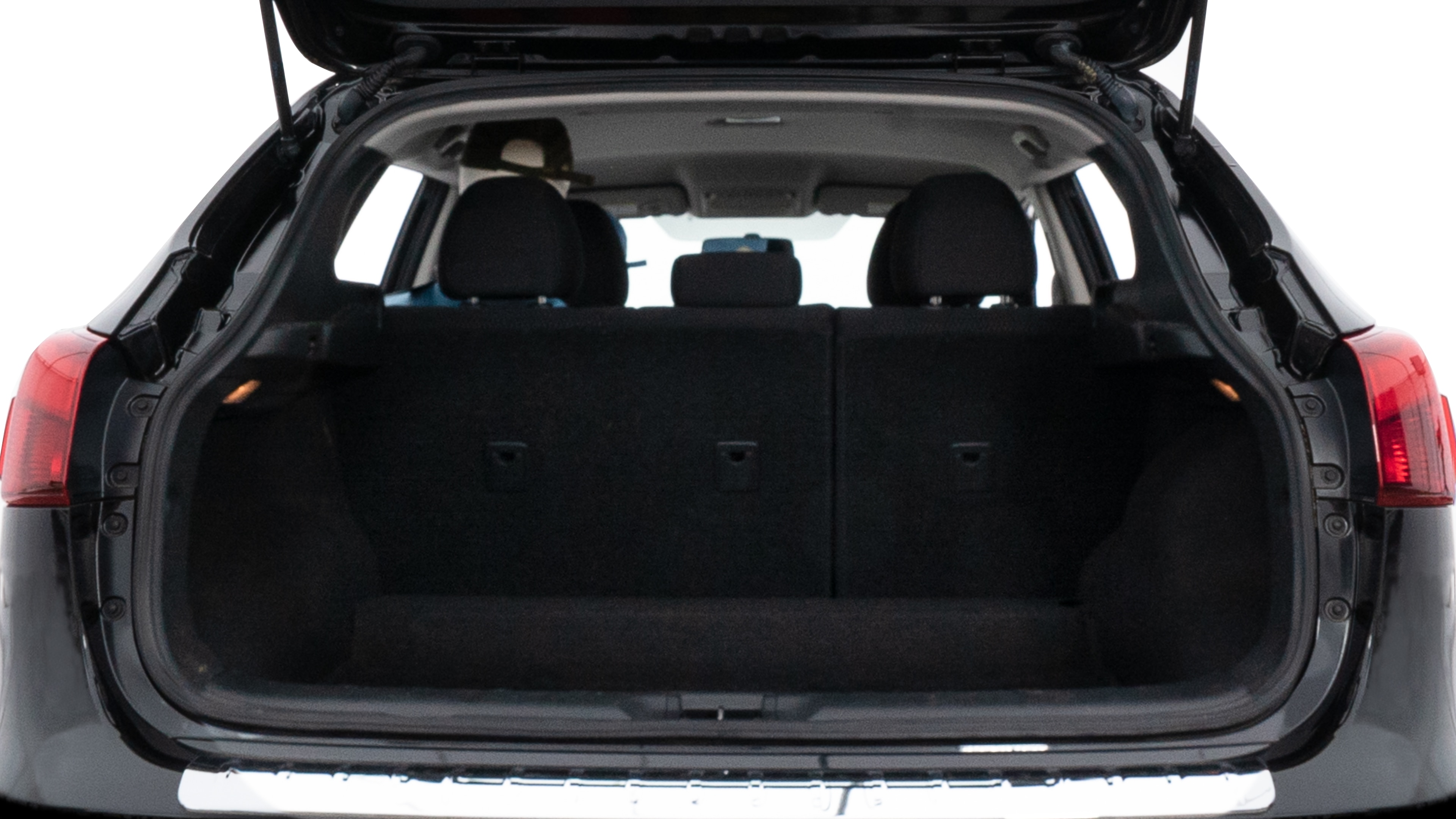 The trunk lid is open, showing full view of the trunk space. Two medium and two small suitcases are placed inside.