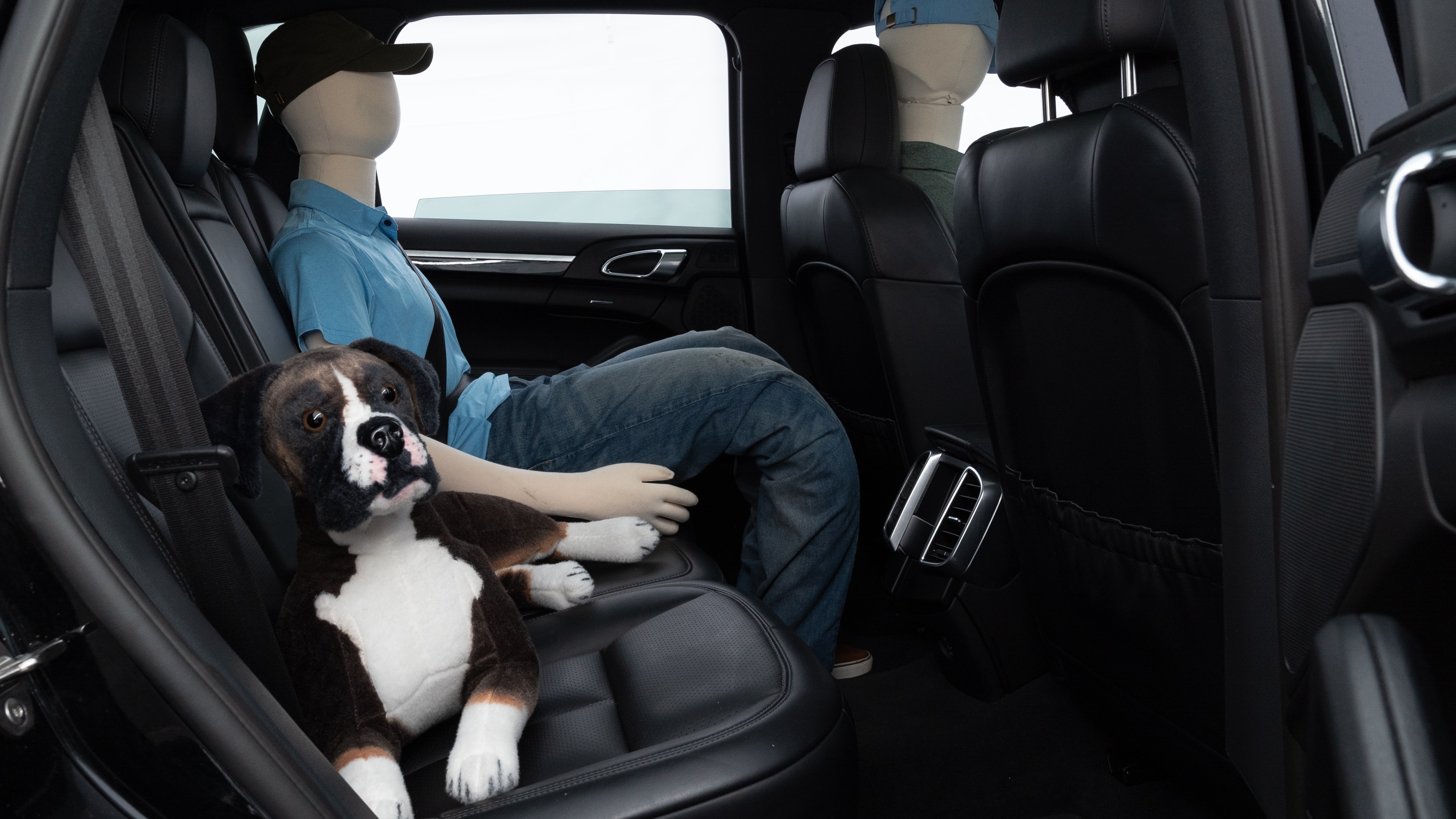 A series of second-row backseat photos is shown including one seating a baby seat and one seating a 6'1" mannequin.