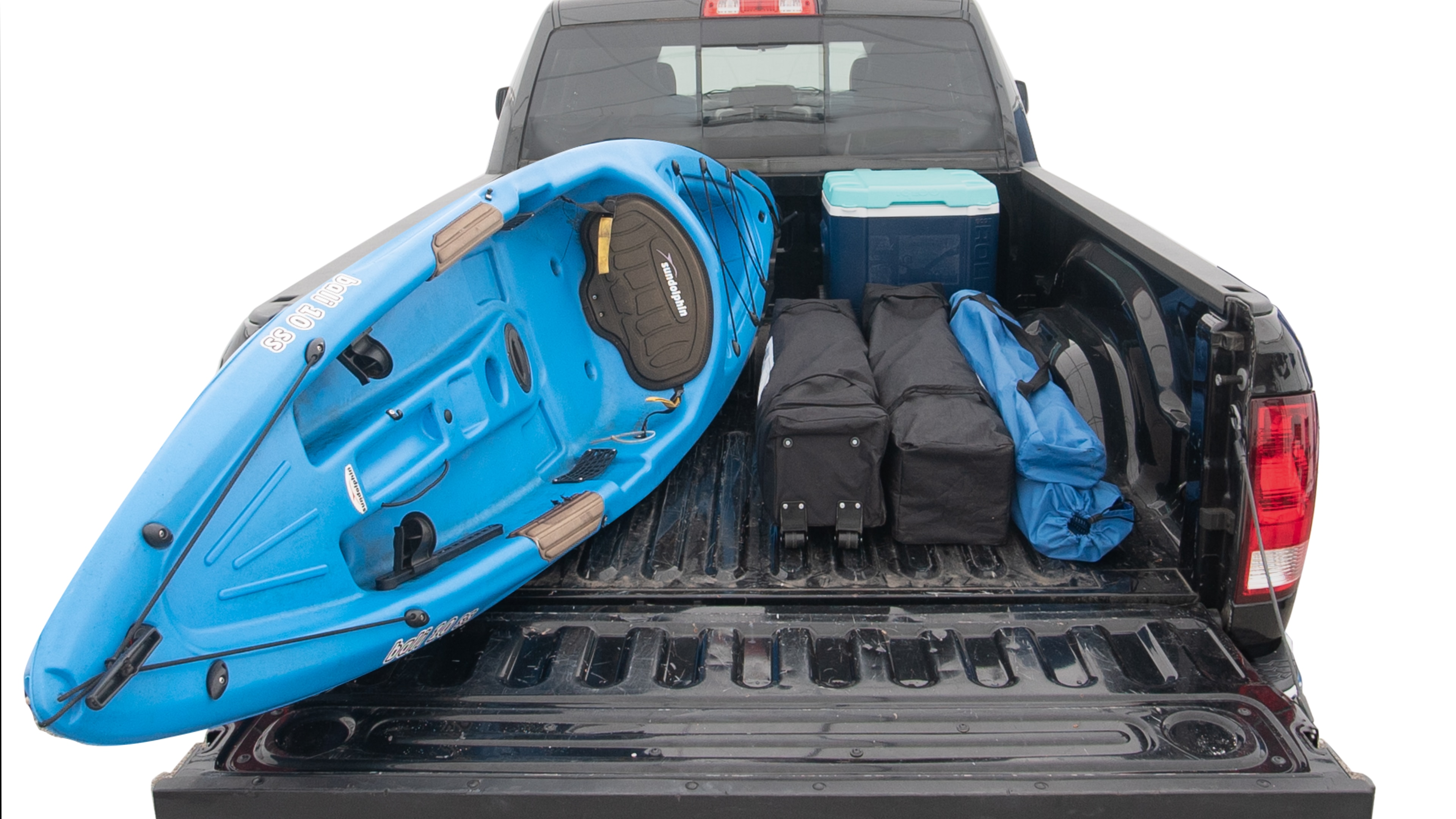 The trunk area is open giving a full view of the trunk area. A cooler, two camping chairs, two tailgate tent and a kayak are placed inside. 