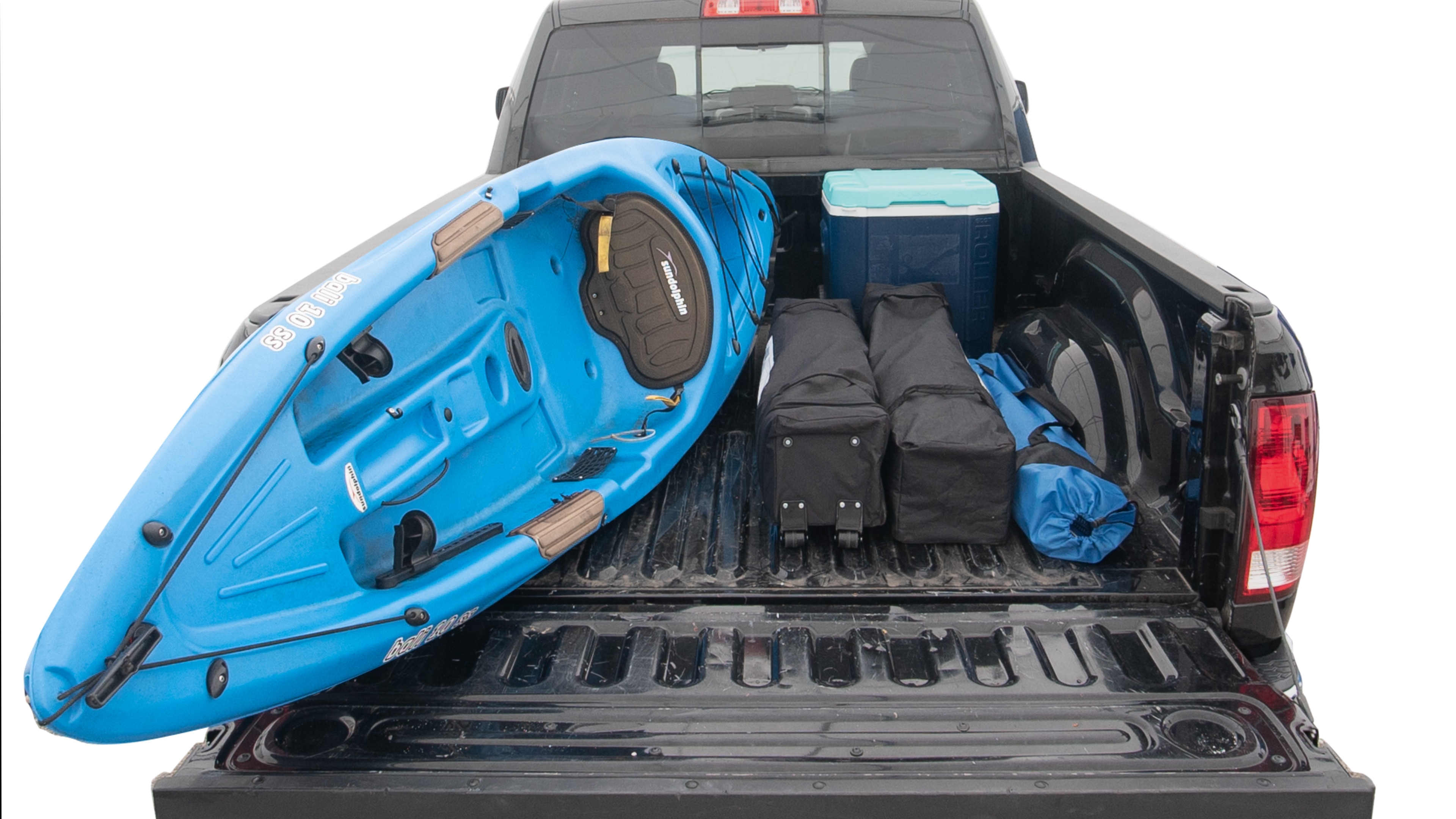 The trunk area is open giving a full view of the trunk area. A cooler, two camping chairs, two tailgate tent and a kayak are placed inside. 