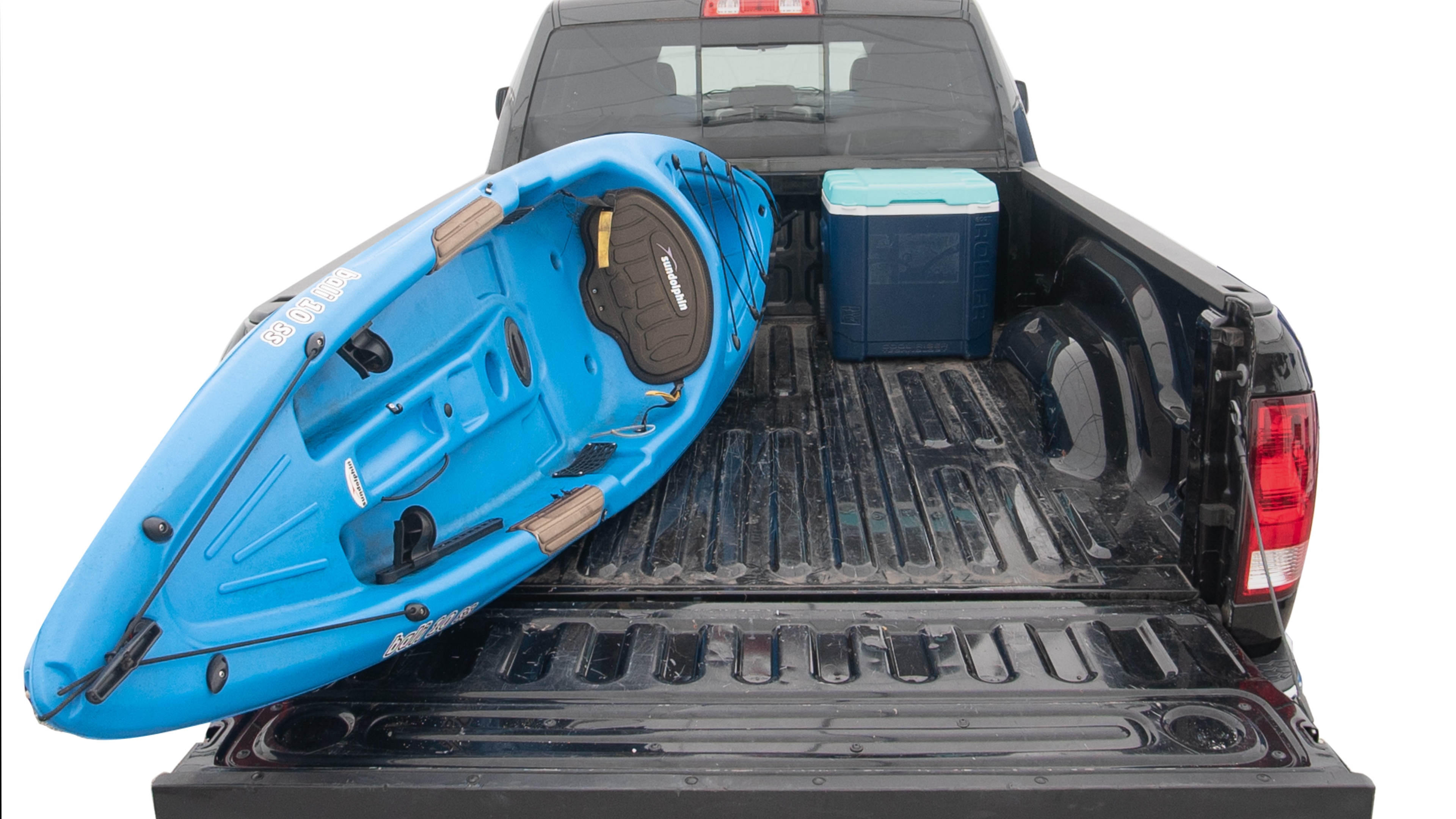 The trunk area is open giving a full view of the trunk area. A cooler, two camping chairs, two tailgate tent and a kayak are placed inside. 