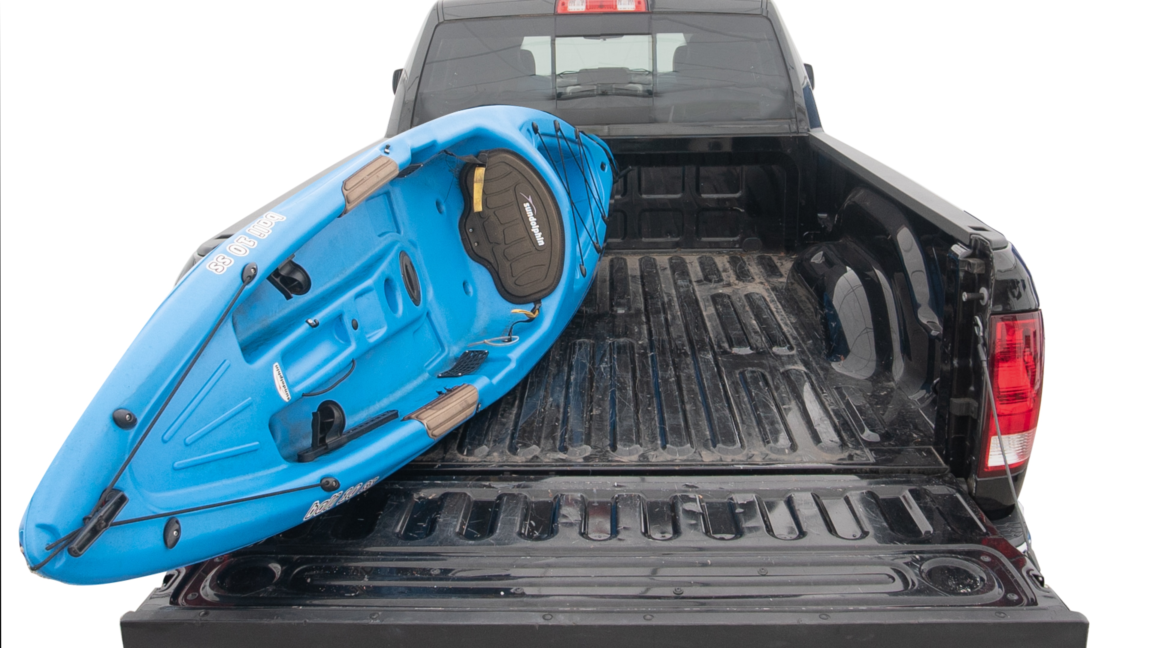 The trunk area is open giving a full view of the trunk area. A cooler, two camping chairs, two tailgate tent and a kayak are placed inside. 