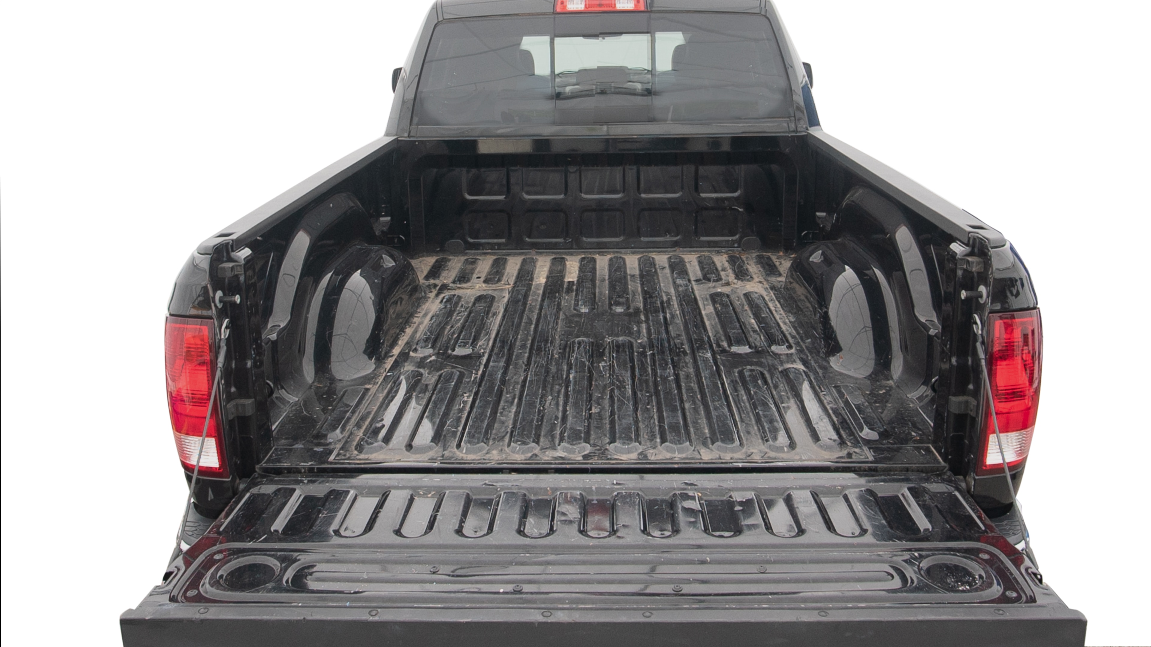 The trunk area is open giving a full view of the trunk area. A cooler, two camping chairs, two tailgate tent and a kayak are placed inside. 