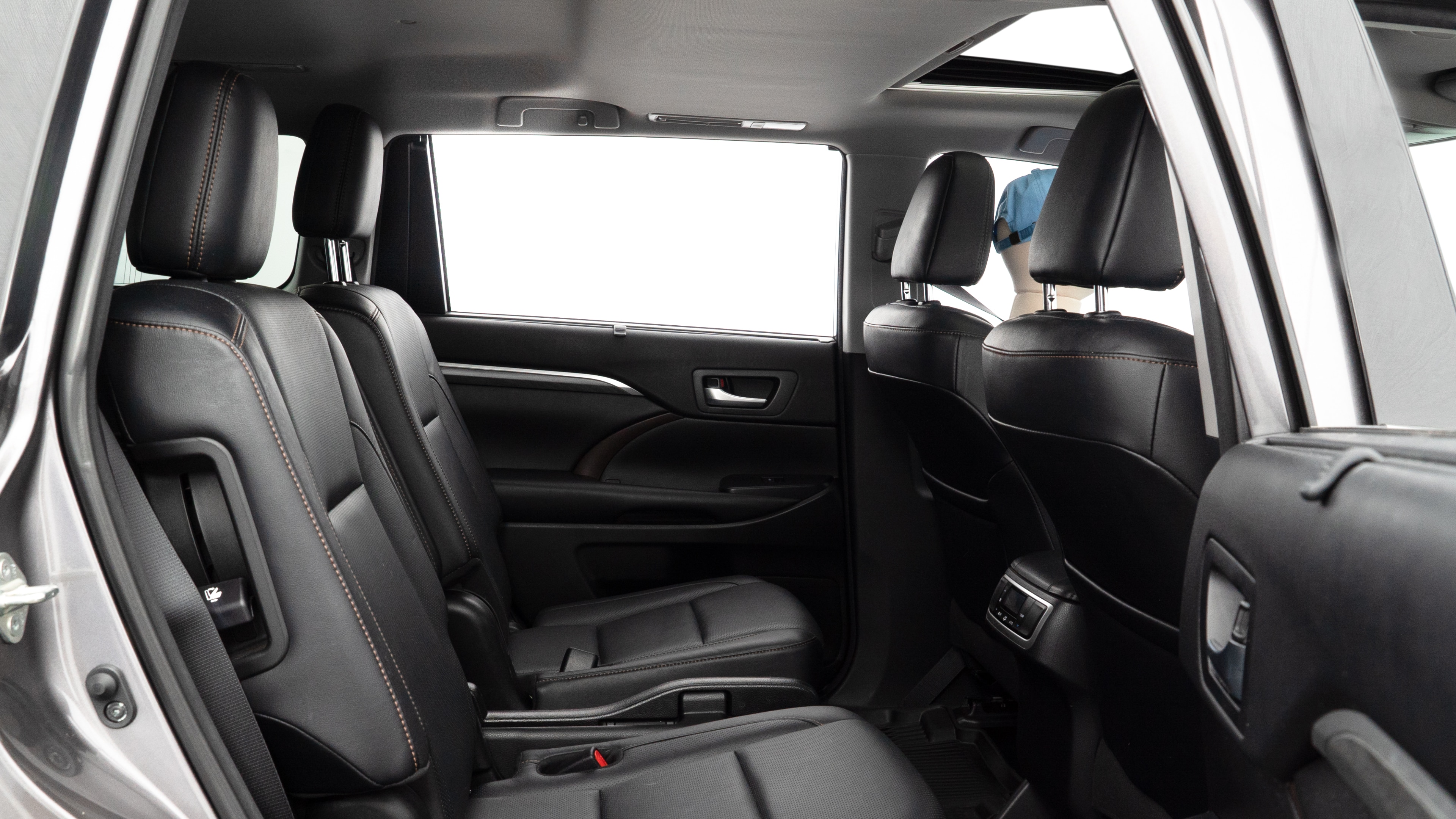 A series of second-row backseat photos is shown including one seating a baby seat and one seating a 6'1" mannequin.