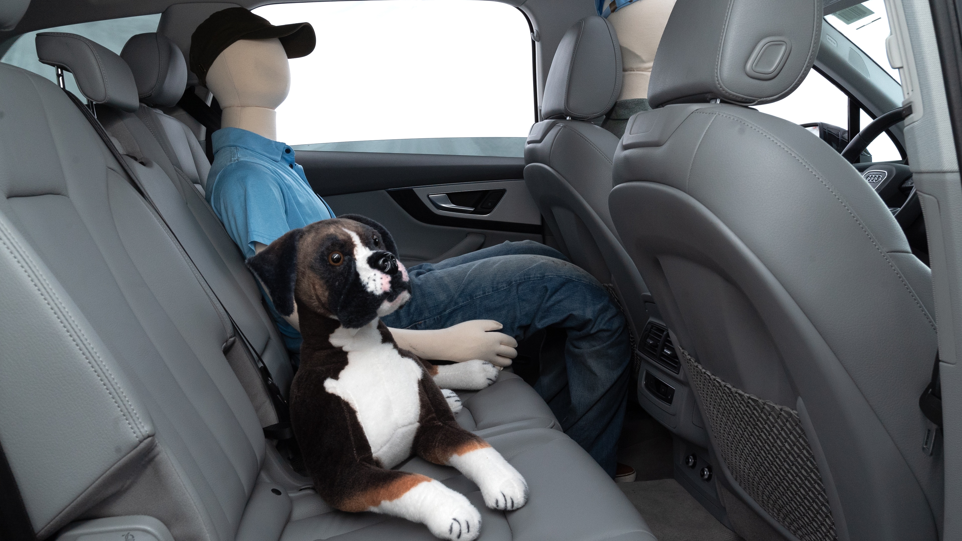 A series of second-row backseat photos is shown including one seating a baby seat and one seating a 6'1" mannequin.